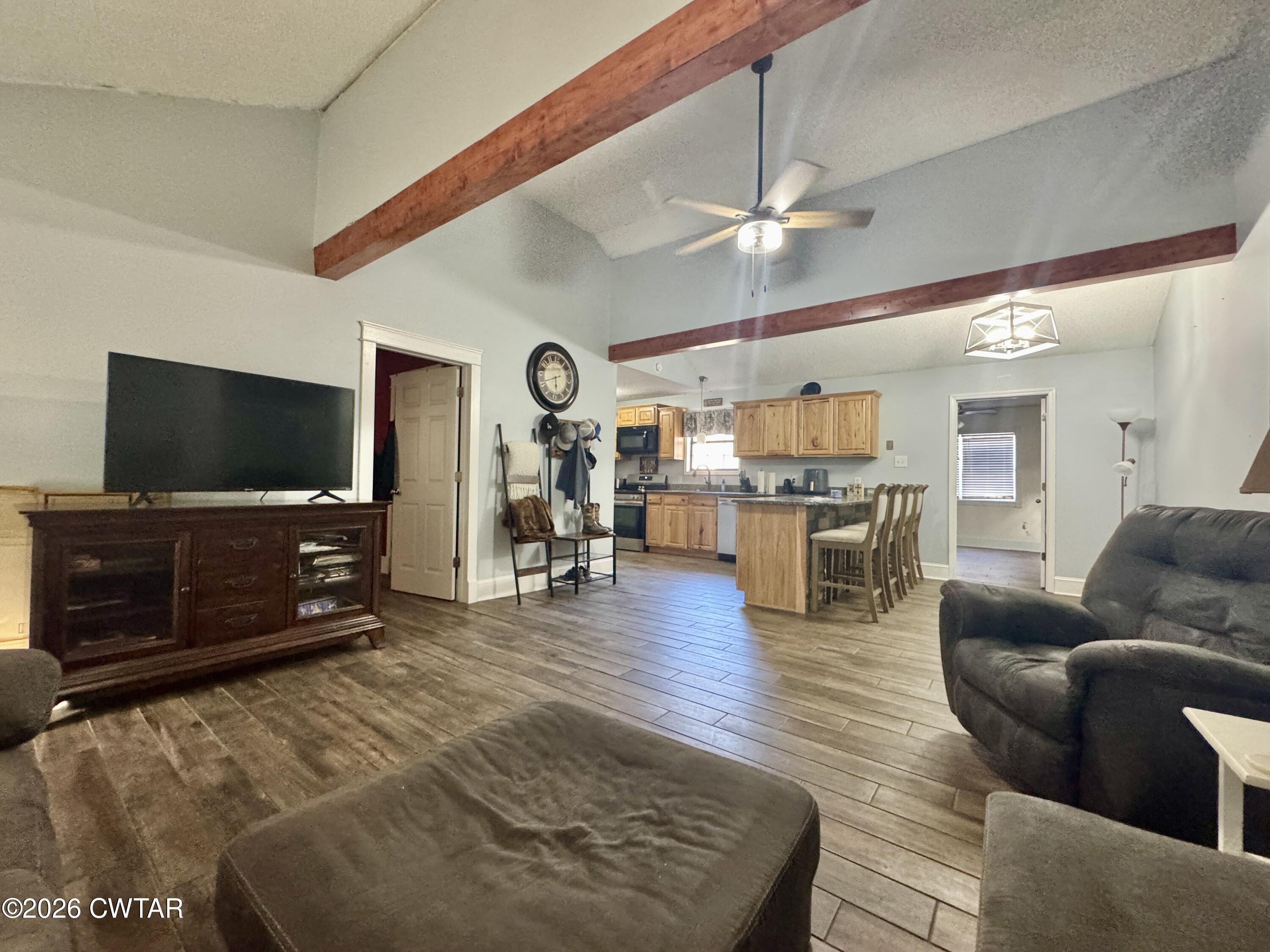 235 Tate Road Dyersburg, TN 38024 - Photo 23 of 34 a living room with furniture and a flat screen tv