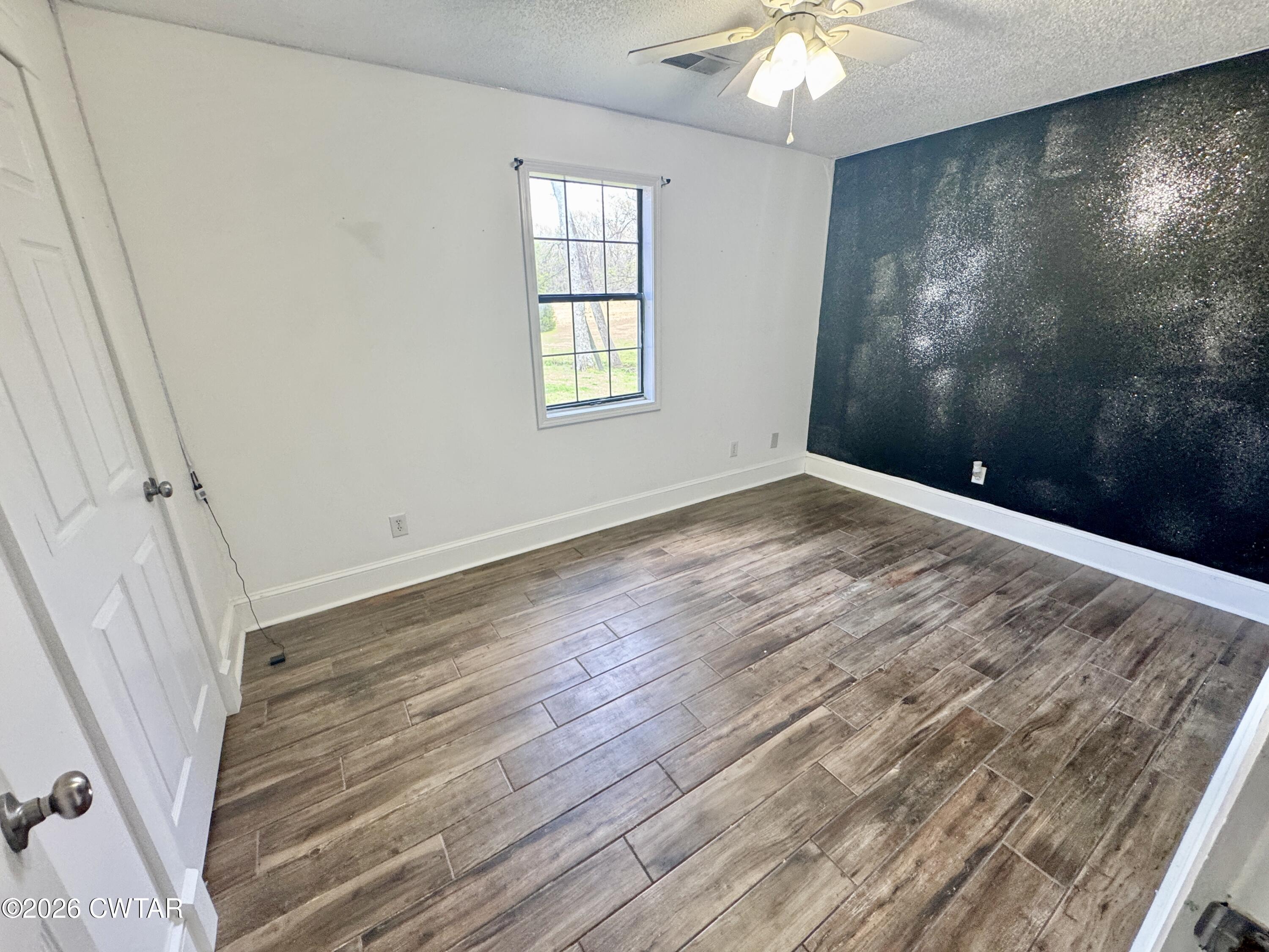 235 Tate Road Dyersburg, TN 38024 - Photo 24 of 34 a view of an empty room with a window