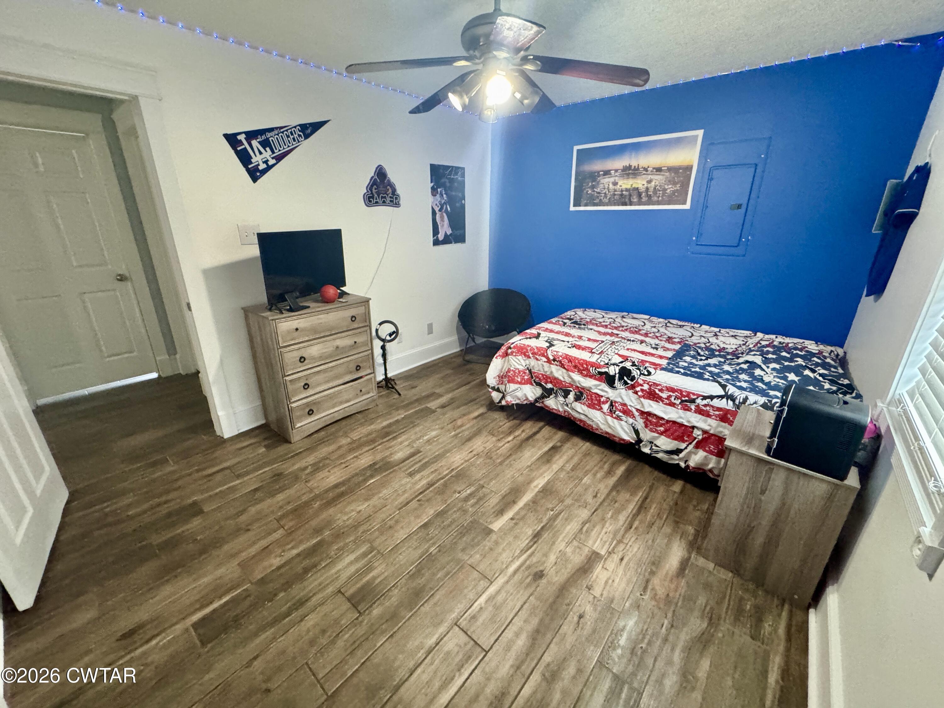 235 Tate Road Dyersburg, TN 38024 - Photo 26 of 34 a bedroom with a bed and a flat screen tv