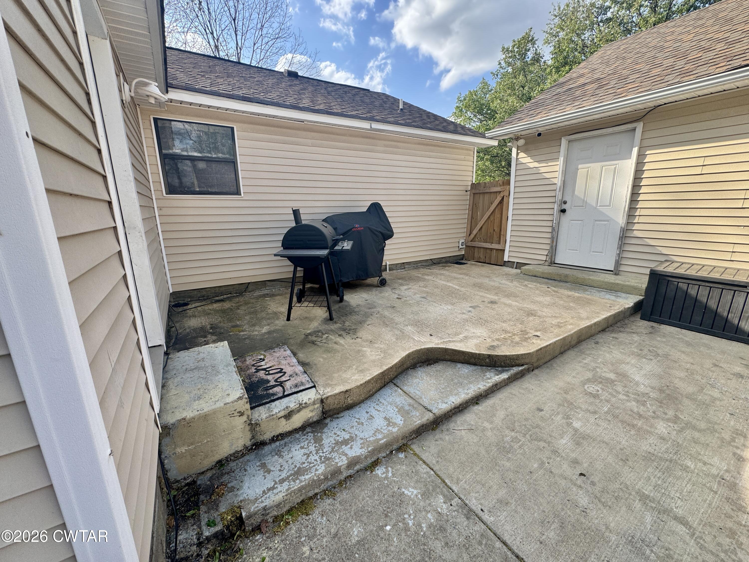 235 Tate Road Dyersburg, TN 38024 - Photo 30 of 34 a view of a backyard with sitting area and furniture