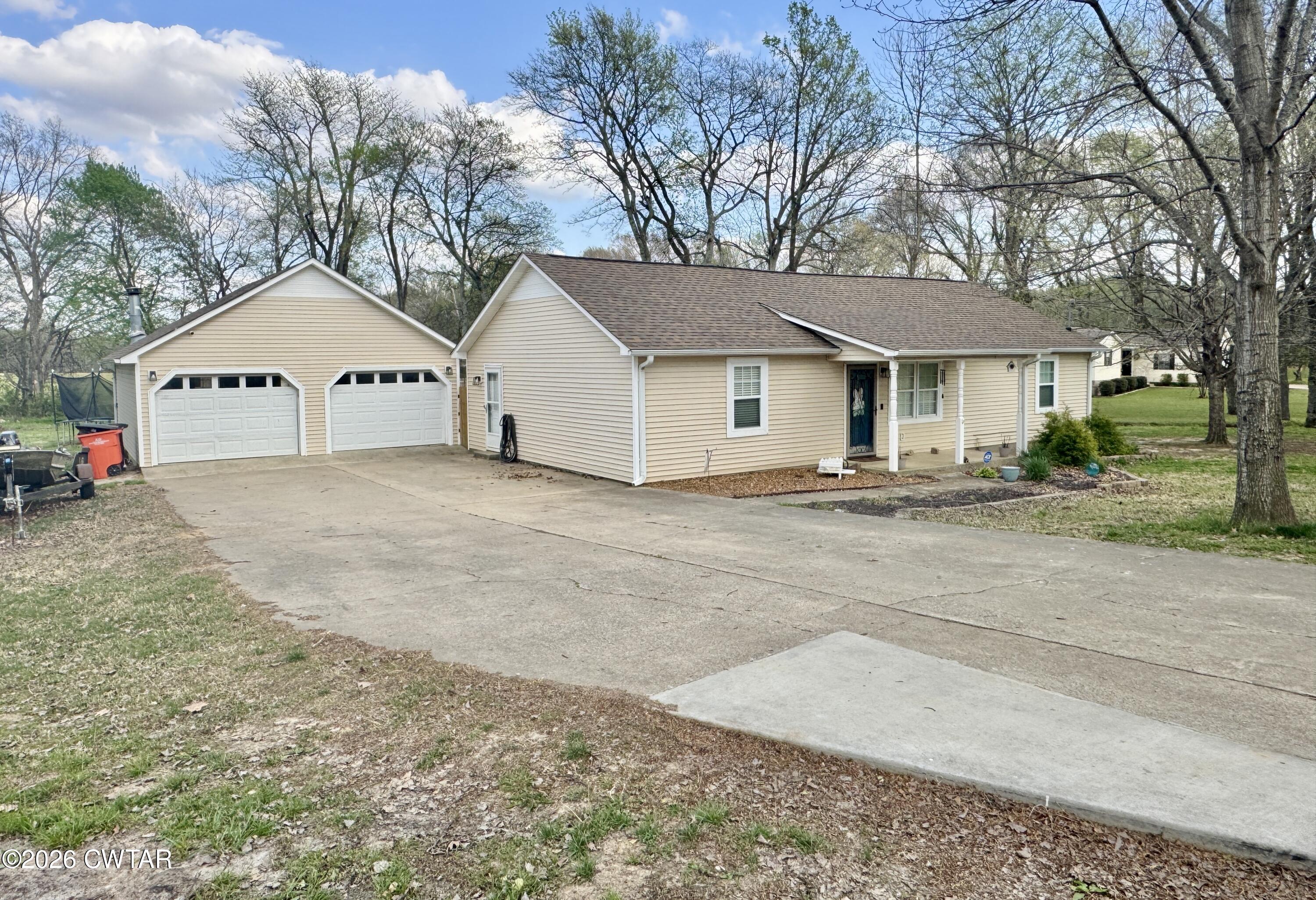235 Tate Road Dyersburg, TN 38024 - Photo 31 of 34 a view of front of a house with a yard