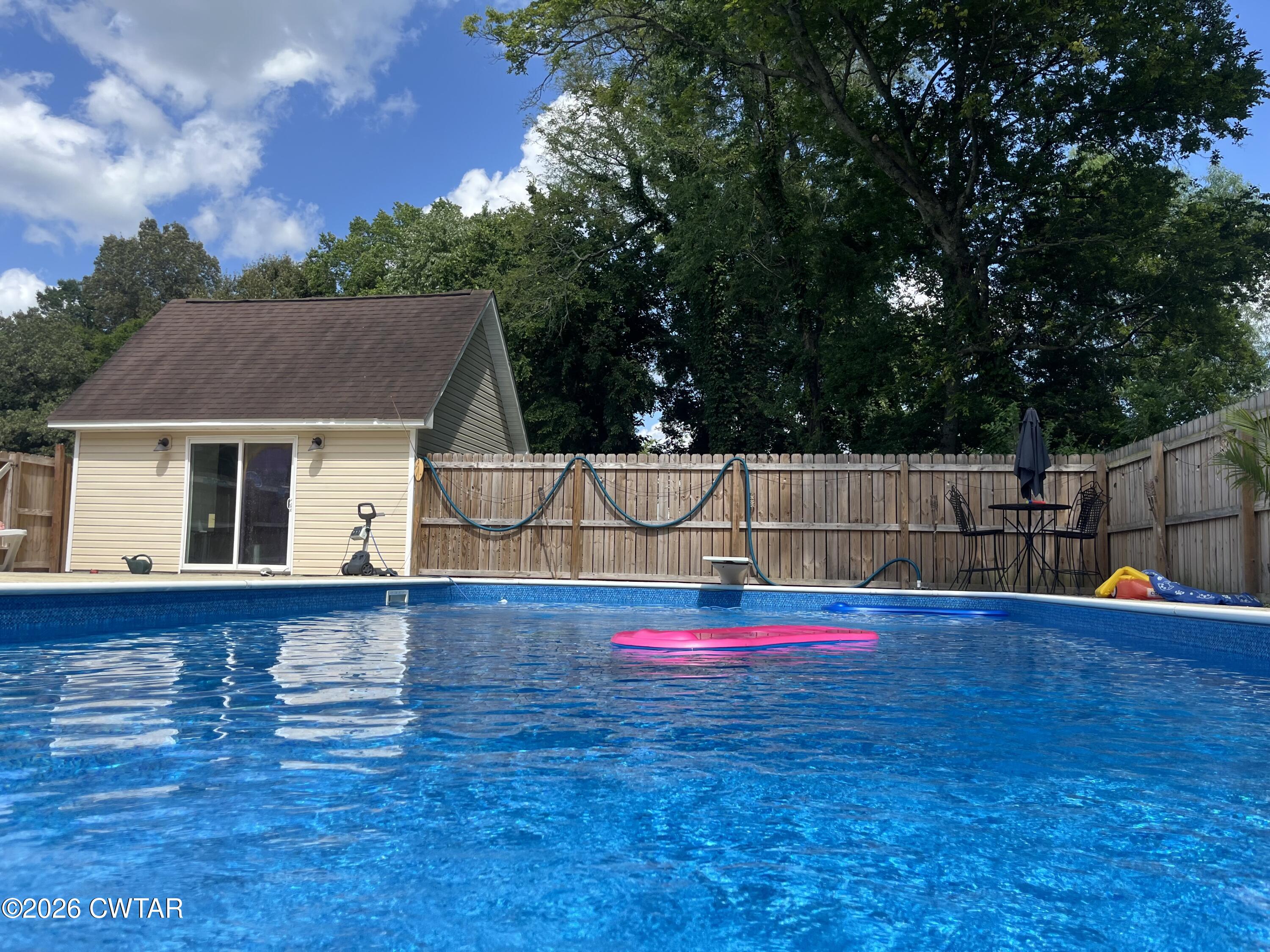 235 Tate Road Dyersburg, TN 38024 - Photo 6 of 34 a view of pool and deck in the backyard