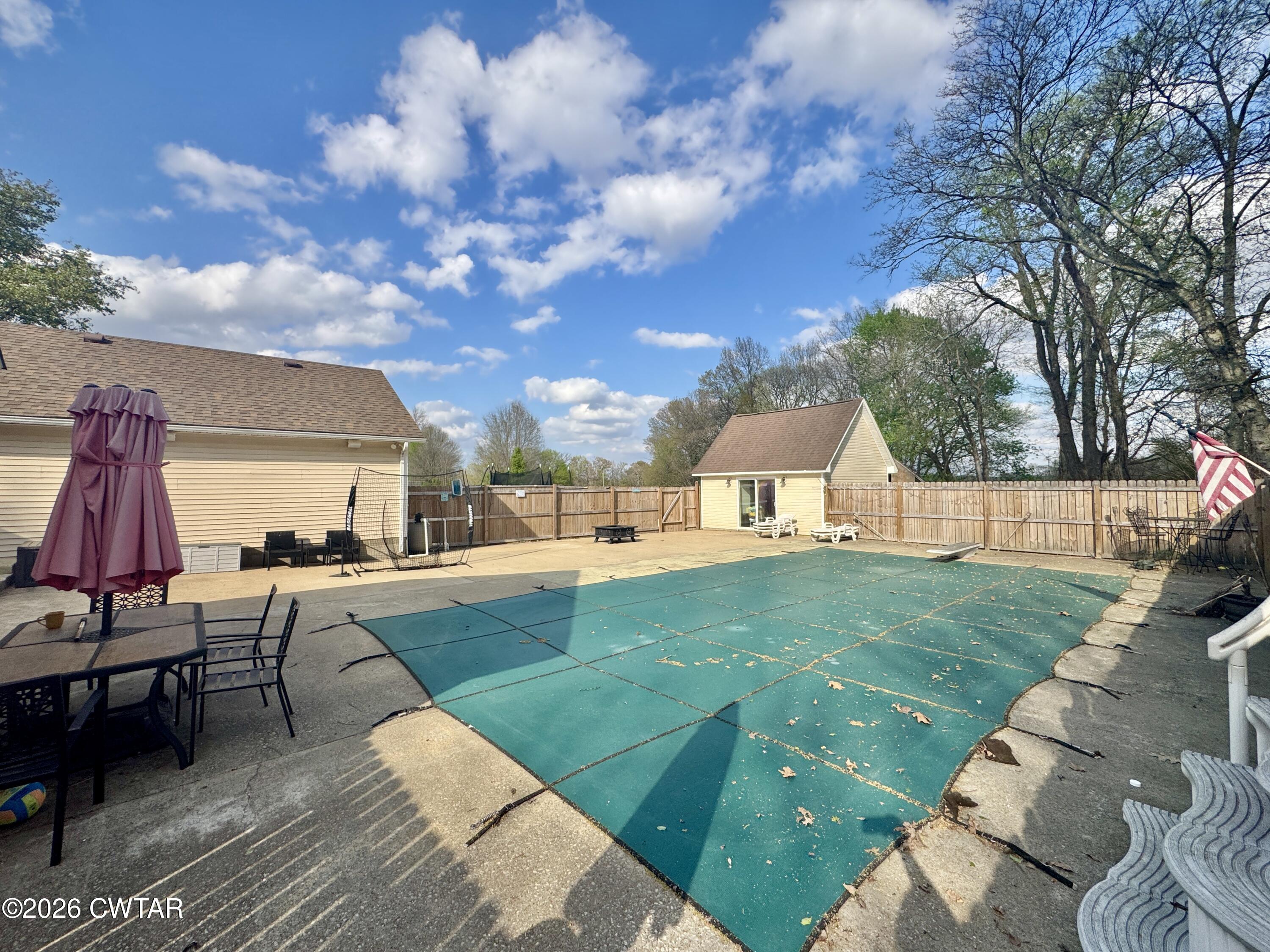 235 Tate Road Dyersburg, TN 38024 - Photo 8 of 34 a view of a backyard with sitting area