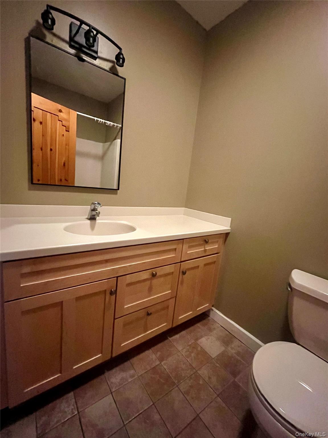 769 Bullville Road Montgomery, NY 12549 - Photo 15 of 19 a bathroom with a toilet sink and mirror