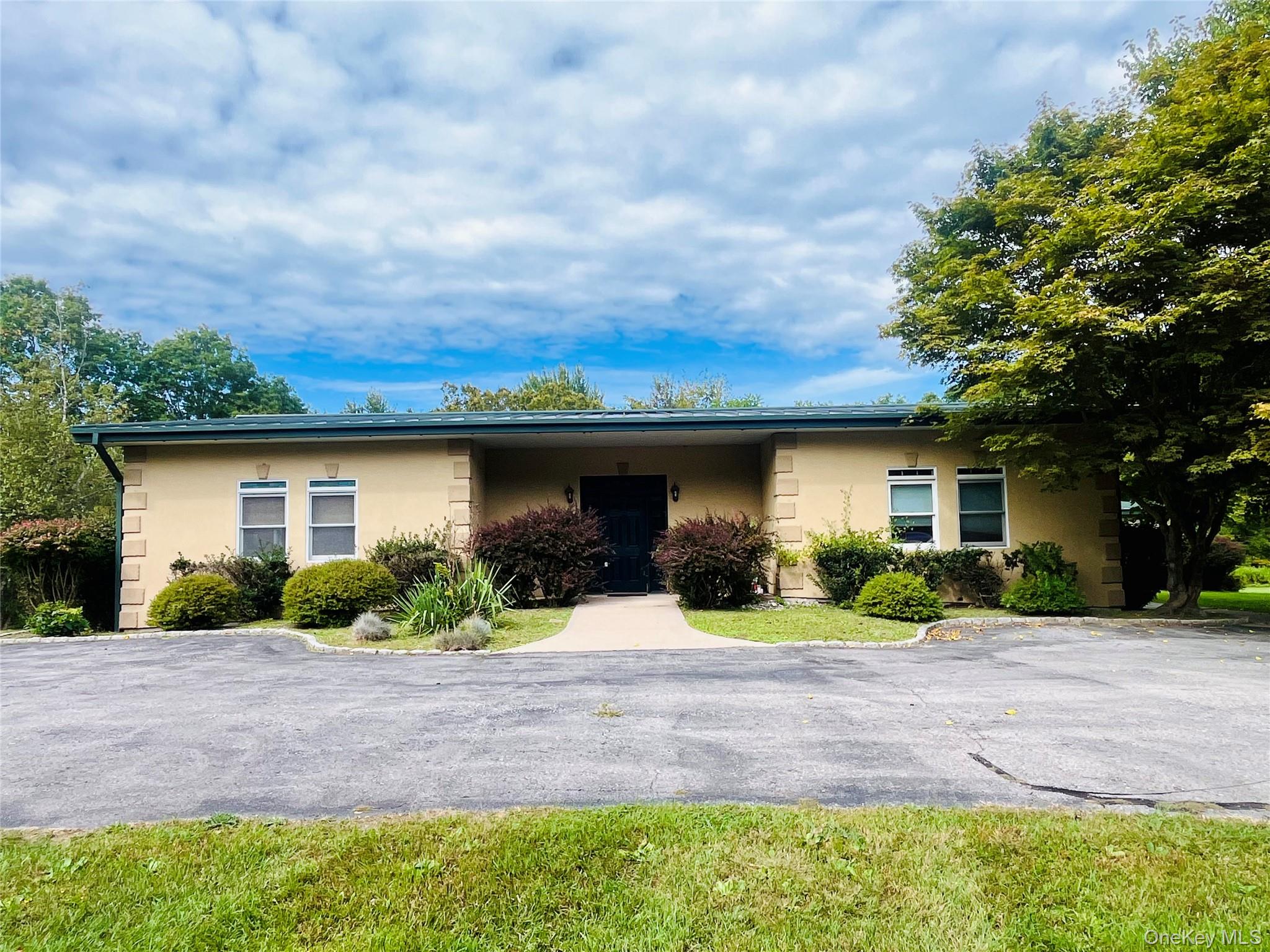 769 Bullville Road Montgomery, NY 12549 - Photo 19 of 19 a front view of a house with a yard and garage