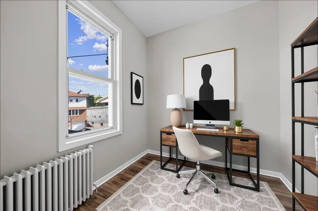 a work room with furniture and a window