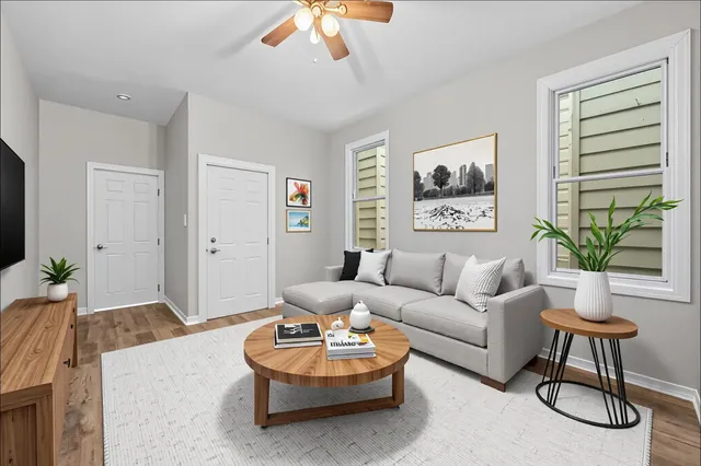 a living room with furniture and a large window