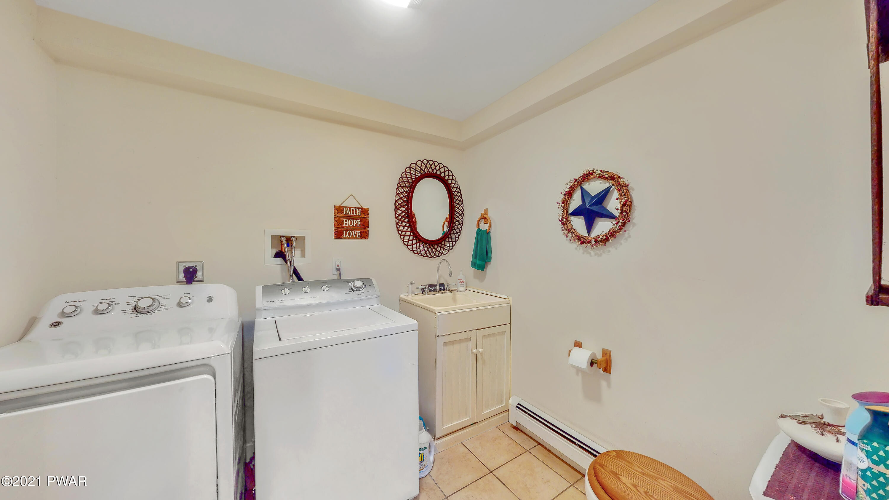 112 Neversink Road Shohola, PA 18458 - Photo 12 of 44 Feature Photo: Half Bath & Laundry Room