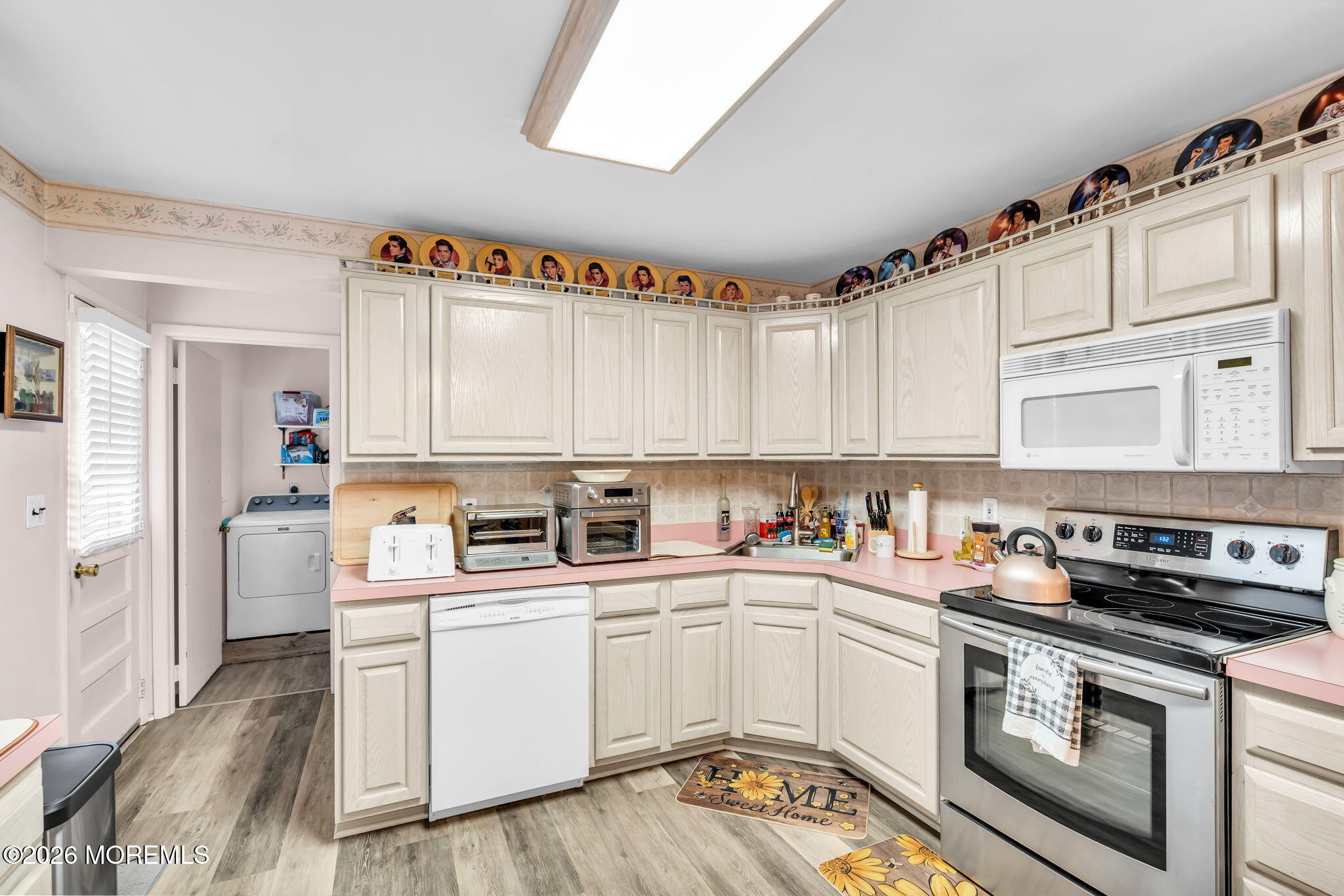 203 Freehold Road Jackson, NJ 08527 - Photo 12 of 33 a kitchen with a white cabinets and white appliances