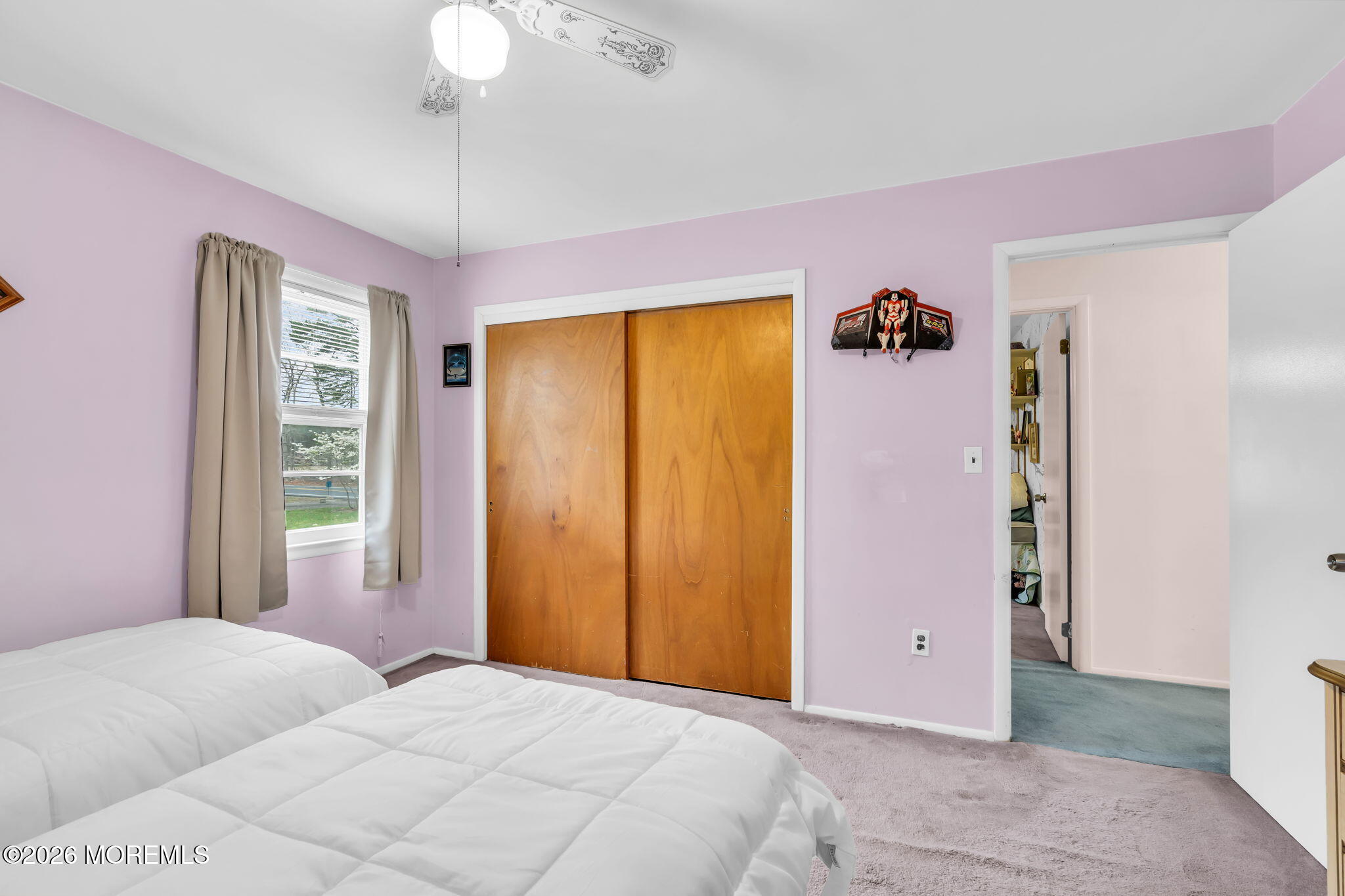 203 Freehold Road Jackson, NJ 08527 - Photo 15 of 33 a bedroom with a bed and a chandelier