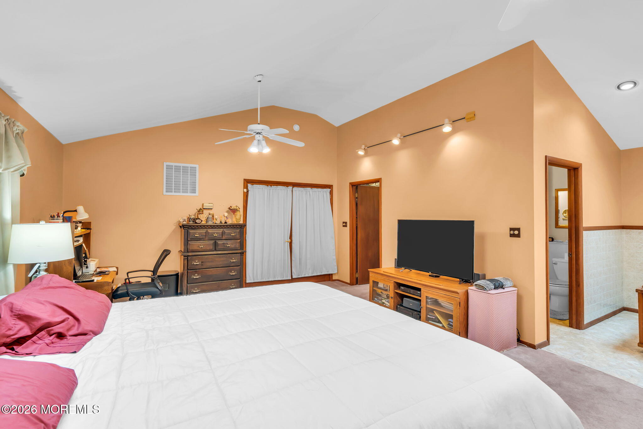203 Freehold Road Jackson, NJ 08527 - Photo 18 of 33 a bedroom with a bed and a flat screen tv