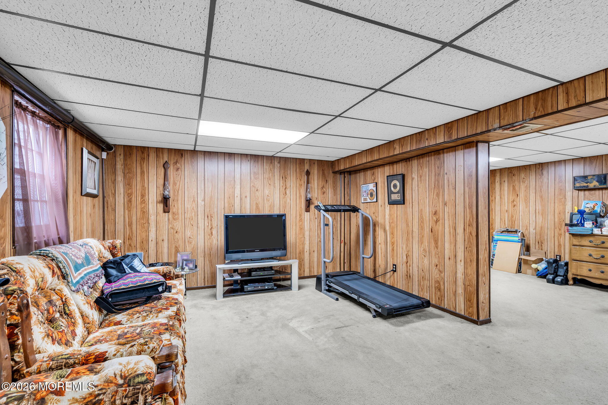 203 Freehold Road Jackson, NJ 08527 - Photo 21 of 33 a living room with furniture a flat screen tv and a window