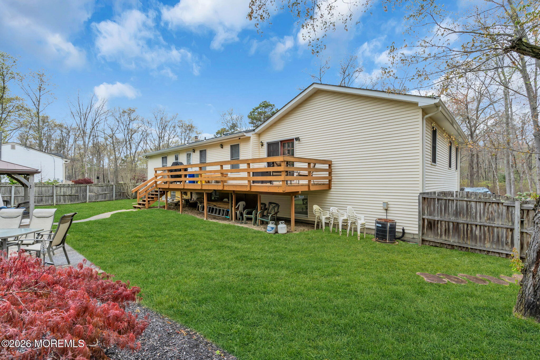 203 Freehold Road Jackson, NJ 08527 - Photo 27 of 33 a view of a house with a yard and sitting area