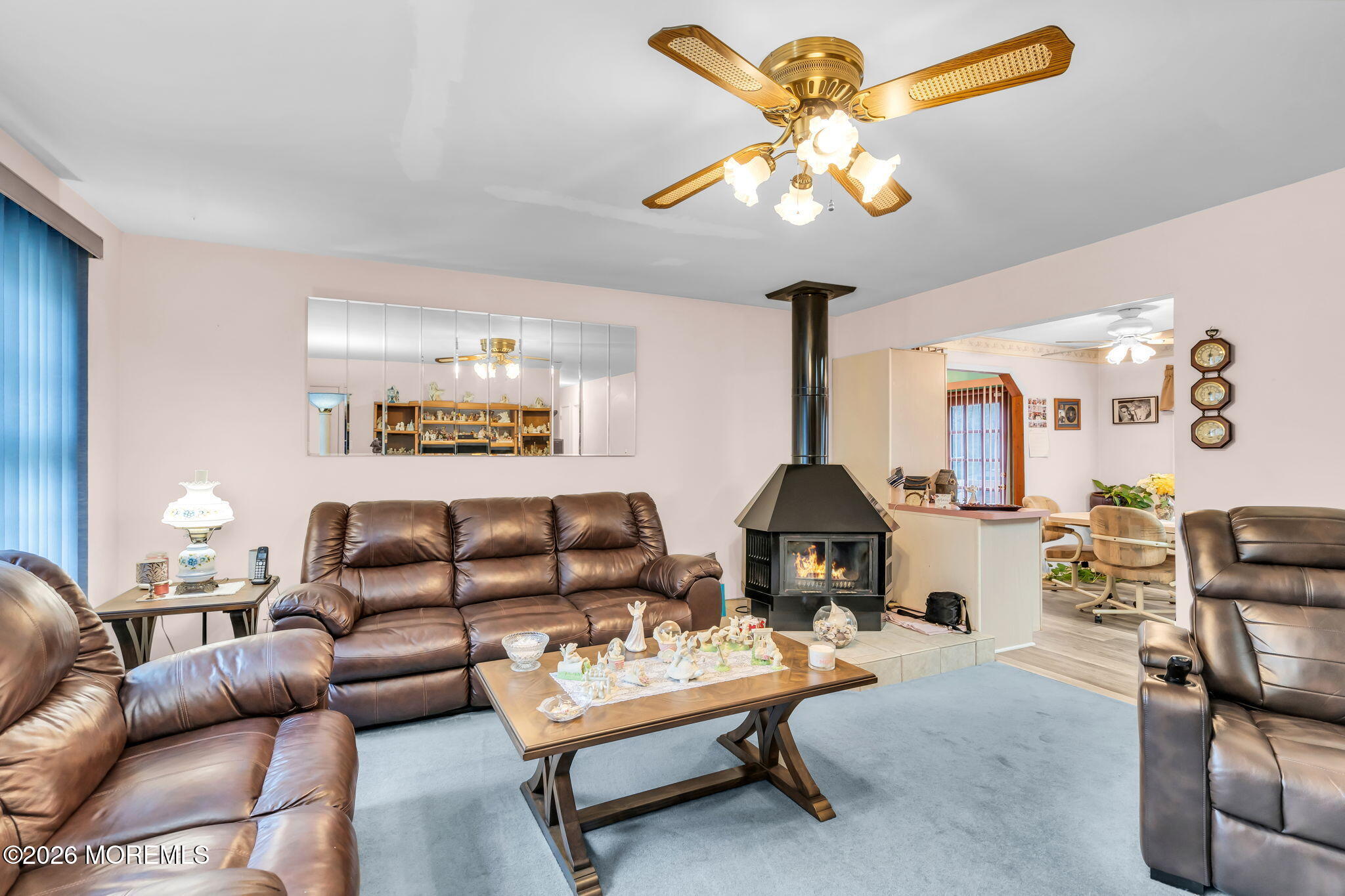 203 Freehold Road Jackson, NJ 08527 - Photo 4 of 33 a living room with furniture and a chandelier