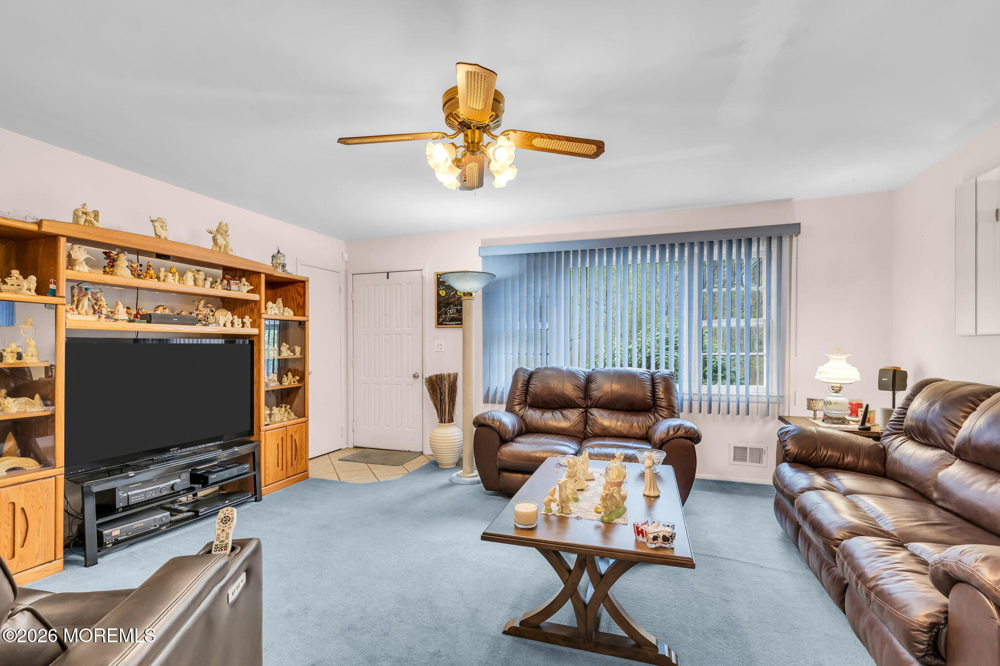 203 Freehold Road Jackson, NJ 08527 - Photo 6 of 33 a living room with furniture and a flat screen tv