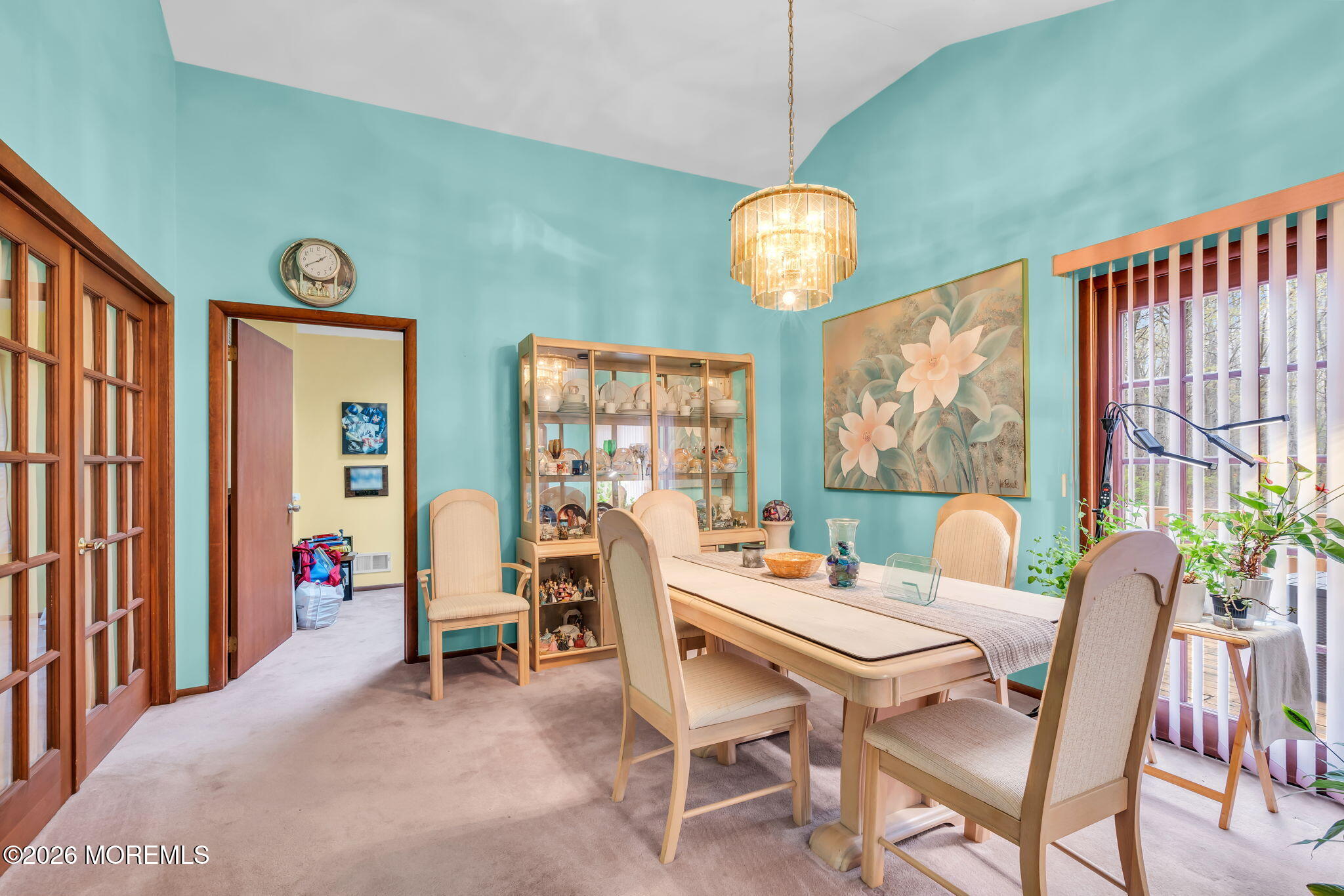 203 Freehold Road Jackson, NJ 08527 - Photo 8 of 33 a view of a dining room with furniture wooden floor and a chandelier