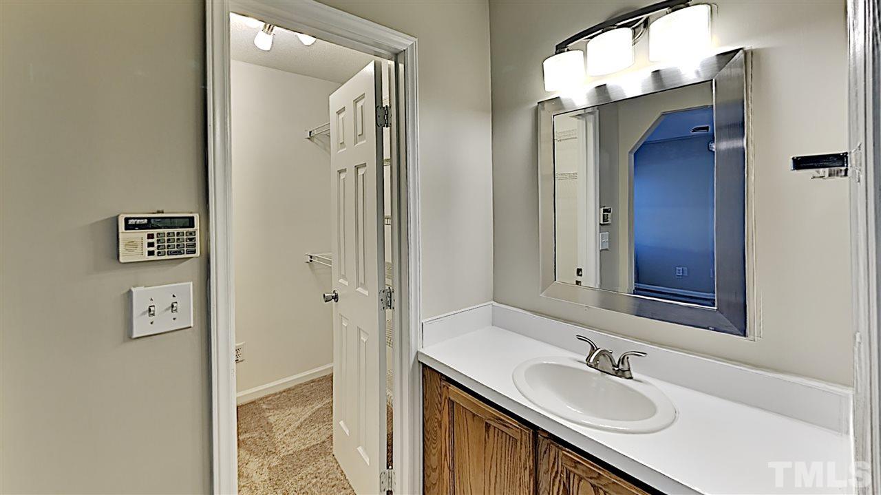 4104 Old Coach Road Raleigh, NC 27616 - Photo 5 of 9 a bathroom with a sink and a mirror