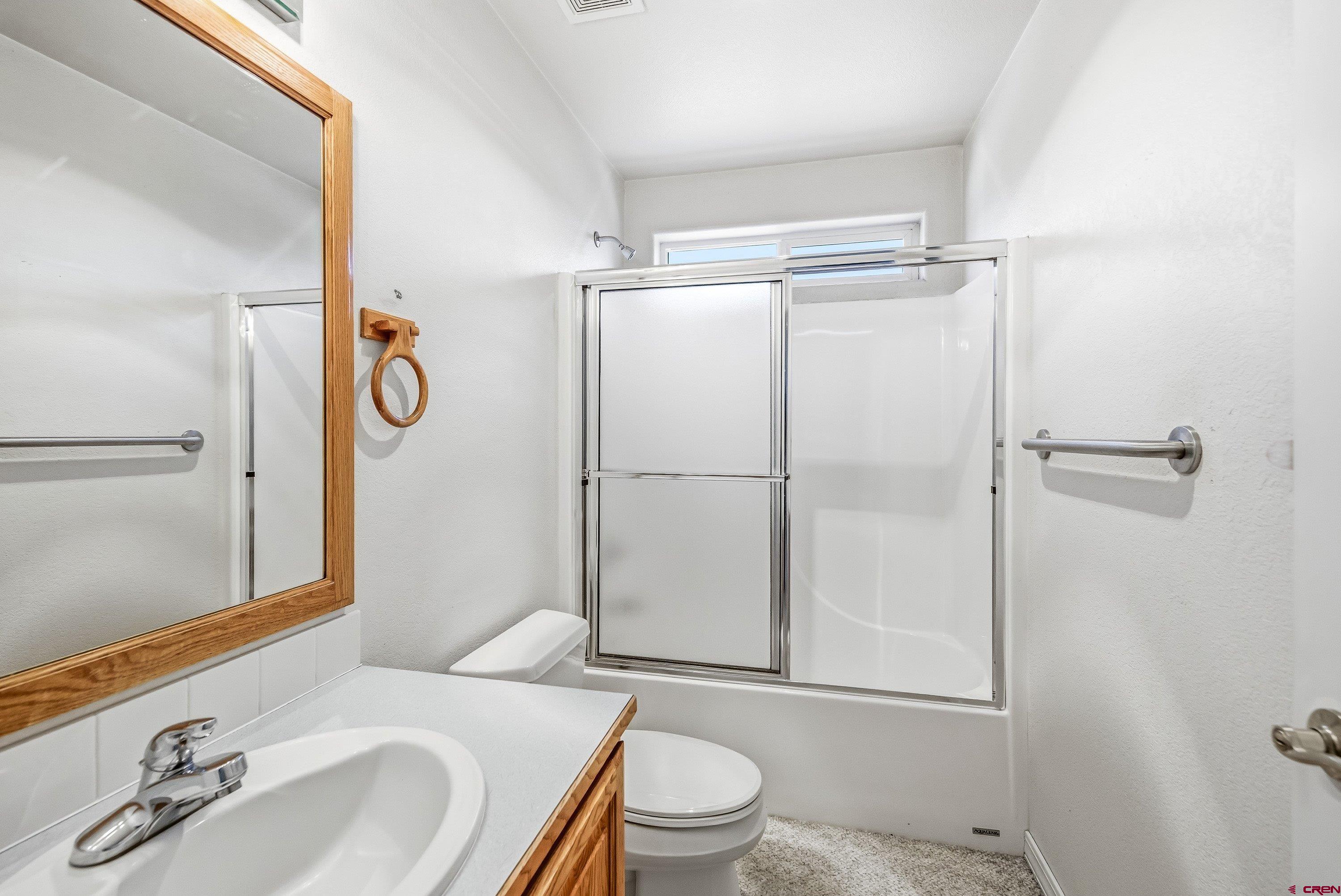24239 Valley View Circle Cedaredge, CO 81413 - Photo 13 of 18 a bathroom with a sink toilet and shower