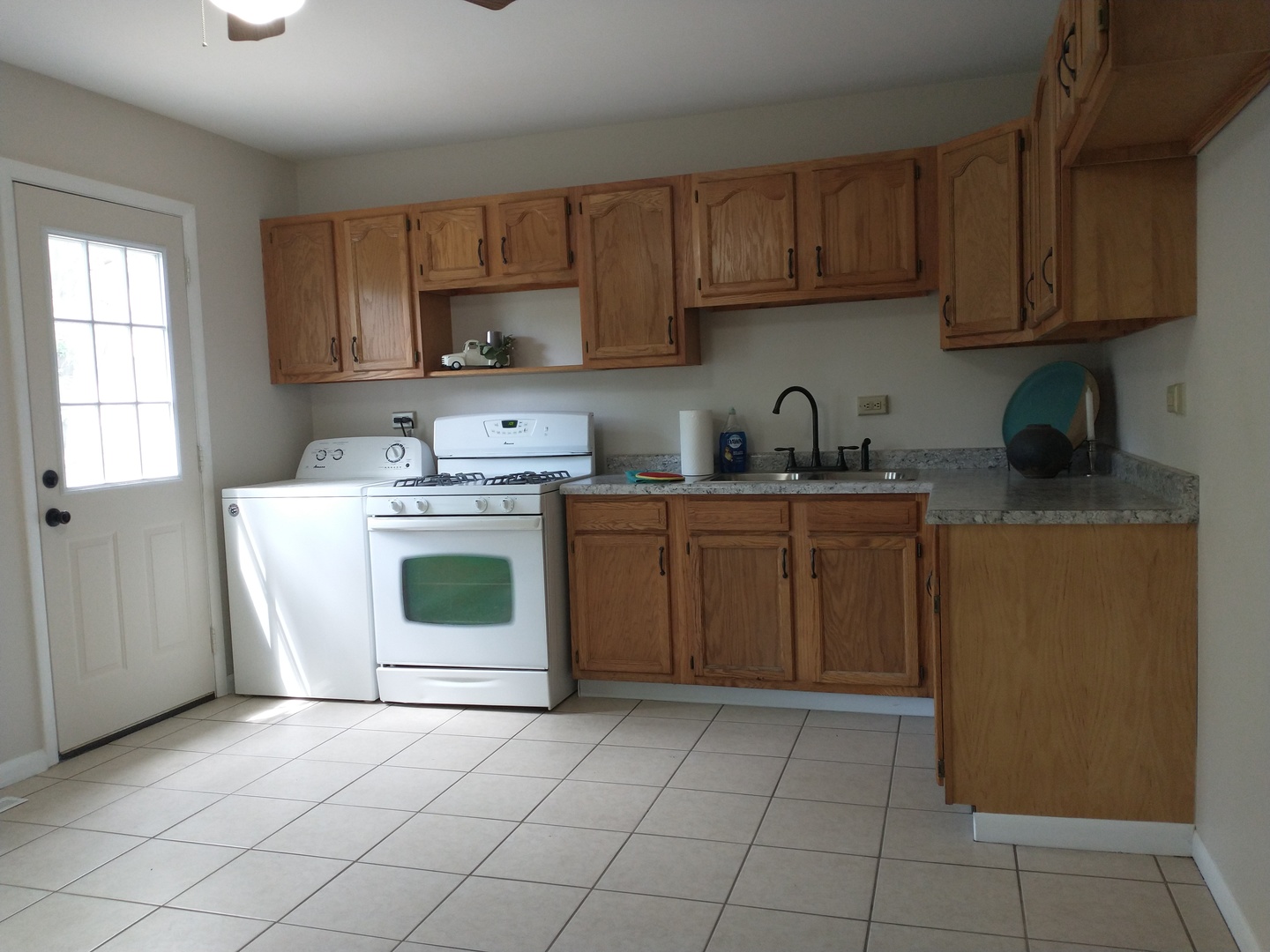 3438 Carpenter Street Steger, IL 60475 - Photo 3 of 10 a kitchen with a stove top oven sink and cabinets