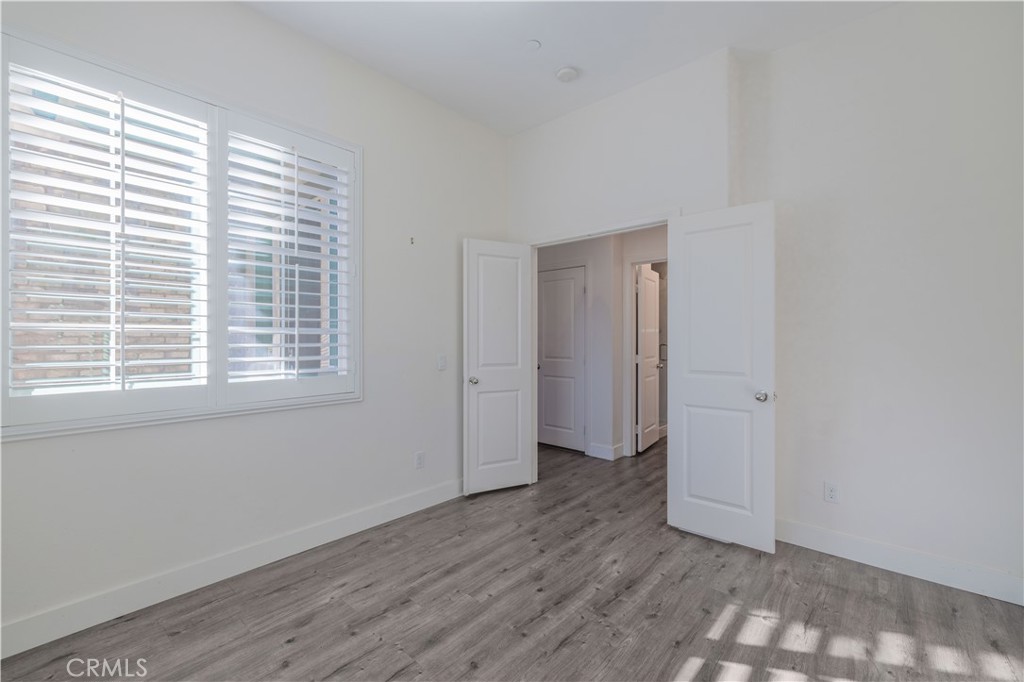 4 Lavanda Street Rancho Mission Viejo, CA 92694 - Photo 14 of 43 an empty room with wooden floor and windows