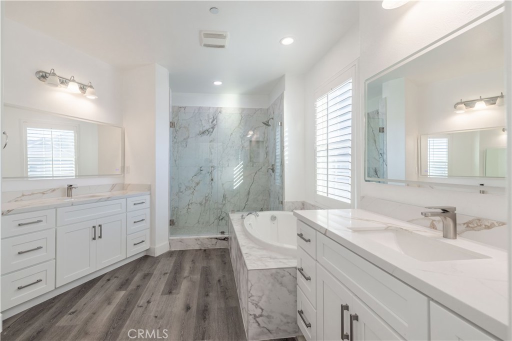 4 Lavanda Street Rancho Mission Viejo, CA 92694 - Photo 23 of 43 a spacious bathroom with a granite countertop sink a toilet a shower and a mirror