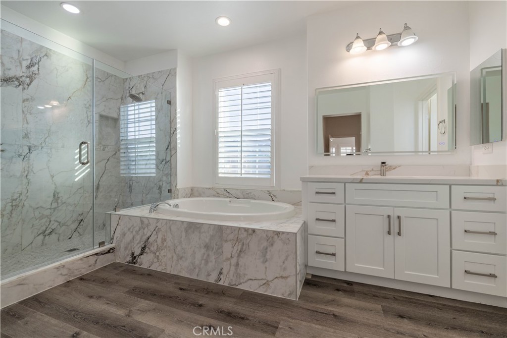 4 Lavanda Street Rancho Mission Viejo, CA 92694 - Photo 24 of 43 a spacious bathroom with double sink a mirror a shower and a bathtub