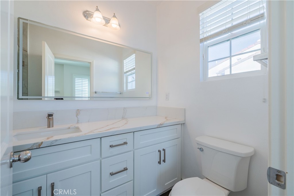 4 Lavanda Street Rancho Mission Viejo, CA 92694 - Photo 37 of 43 a bathroom with a toilet sink and mirror