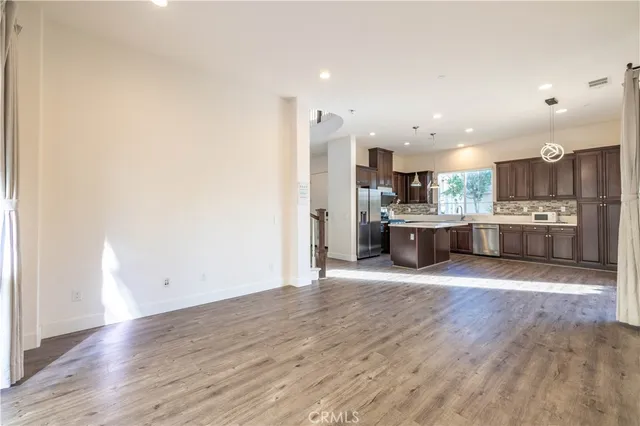 a view of kitchen with wooden floor