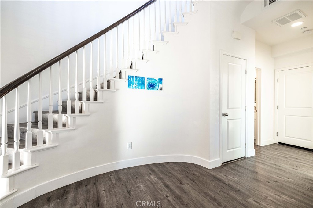4 Lavanda Street Rancho Mission Viejo, CA 92694 - Photo 9 of 43 a view of an entryway with wooden floor