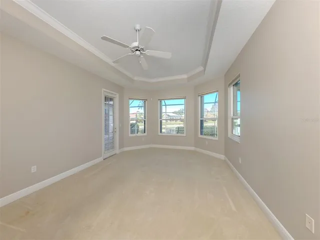 a large bathroom with a large tub sink vanity and granite