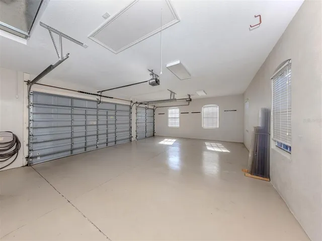 a view of a house with swimming pool and a yard