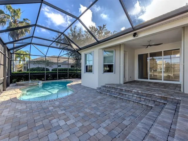 a view of a lake with houses in the back