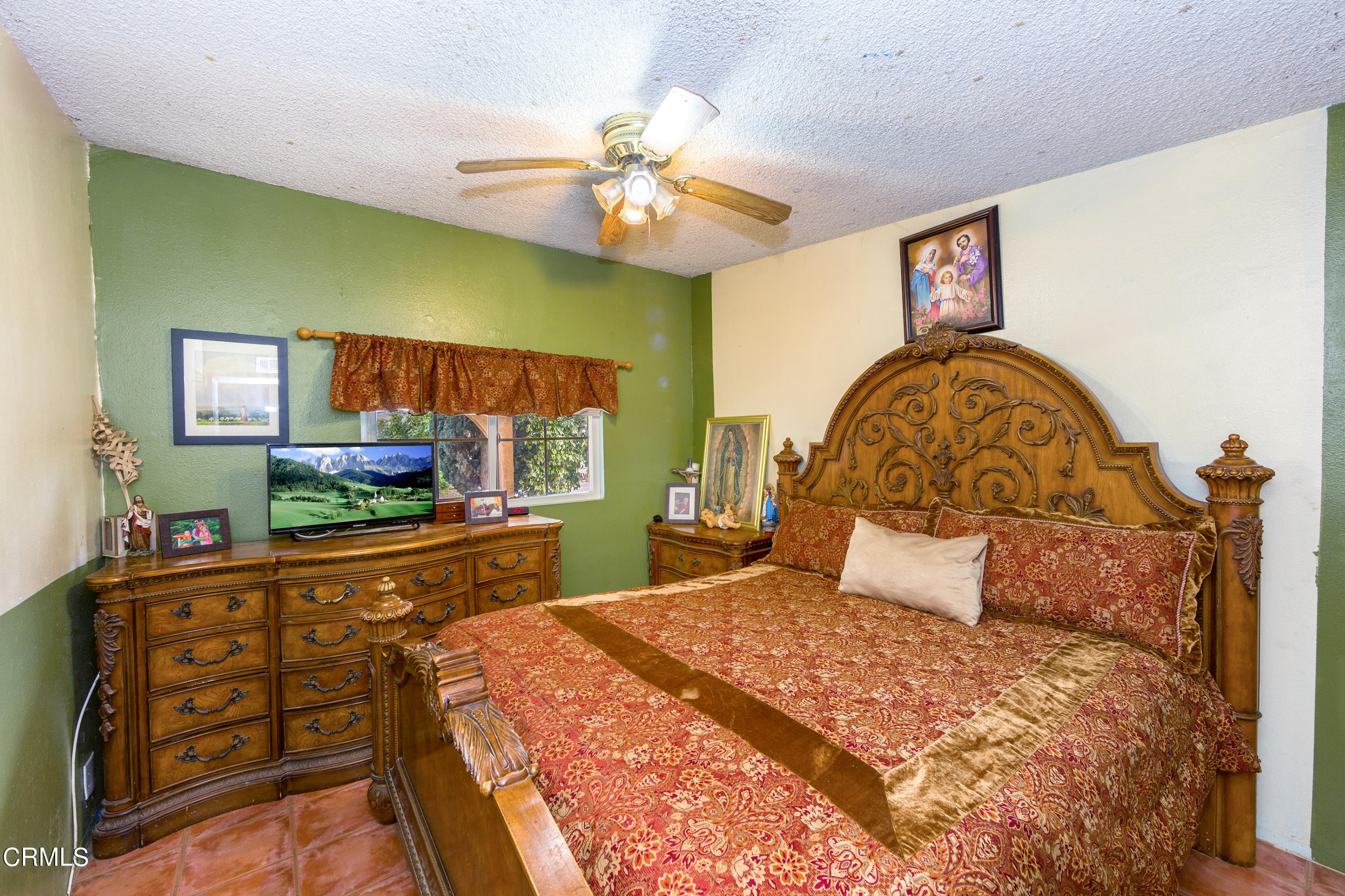 3555 East Telegraph Road Fillmore, CA 93015 - Photo 11 of 21 a bedroom with a bed and a flat screen tv