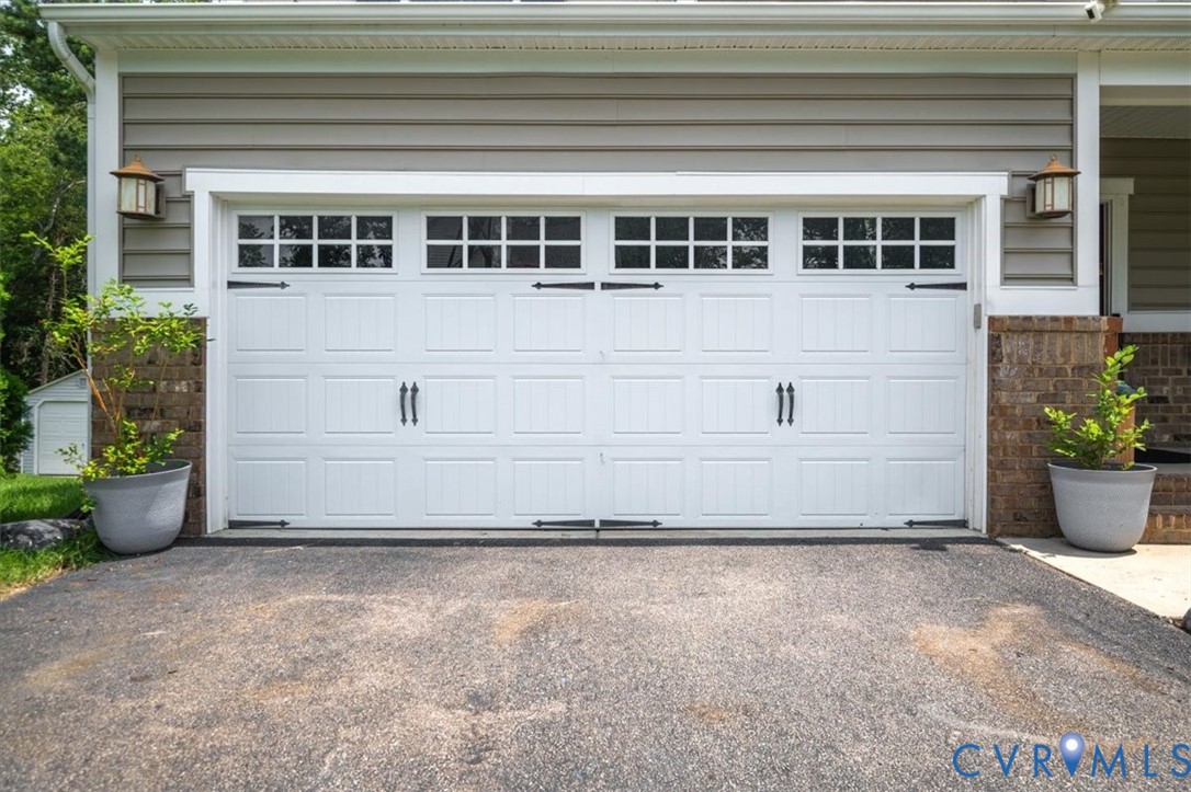 9013 Bailey Hill Road Midlothian, VA 23112 - Photo 3 of 56 White paneled garage door with square window inser