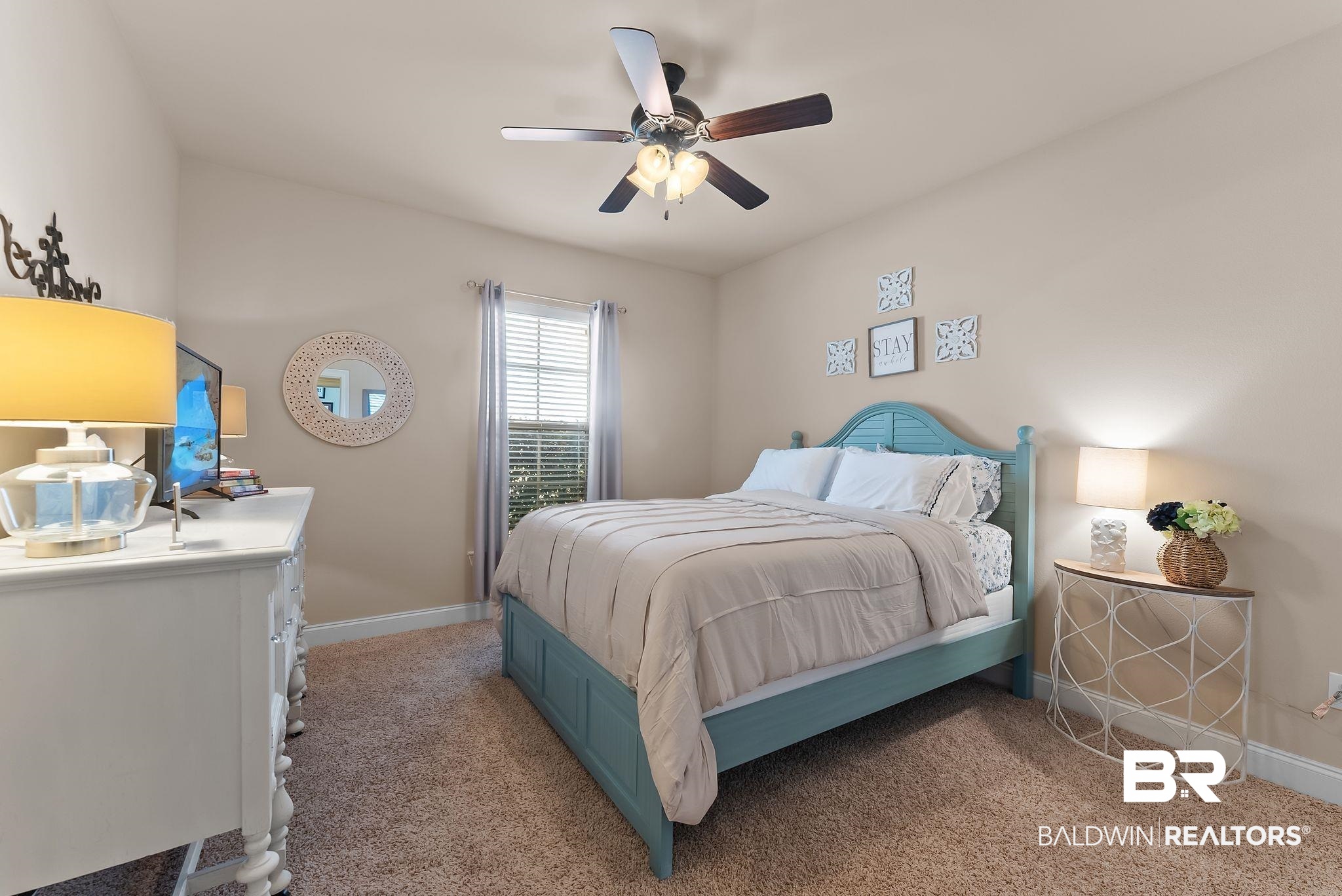 7015 Rocky Rd Loop Gulf Shores, AL 36542 - Photo 23 of 41 Bedroom with light colored carpet and ceiling fan