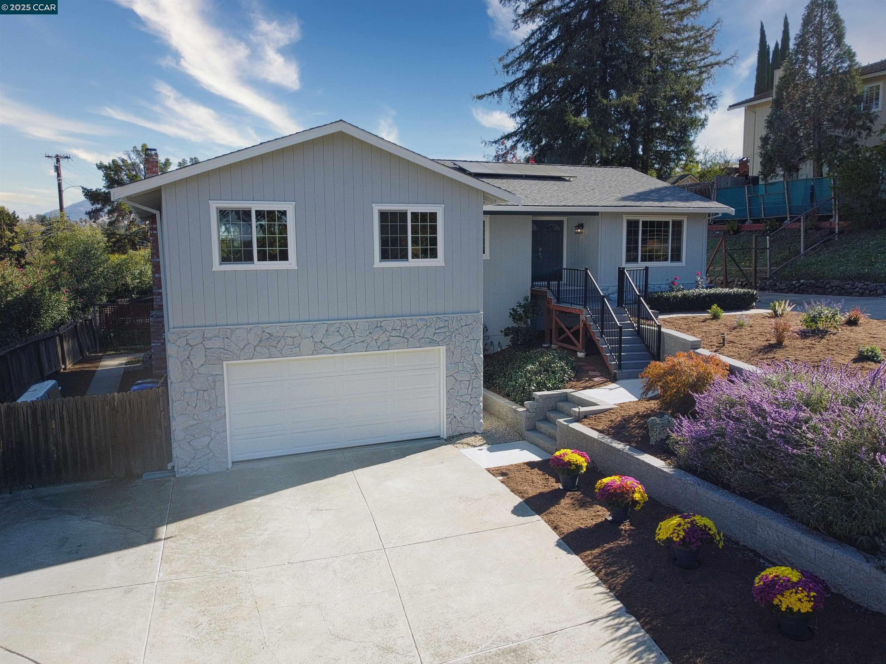 4044 Cowell Road Concord, CA 94518 - Photo 2 of 60 a front view of a house with a yard and garage