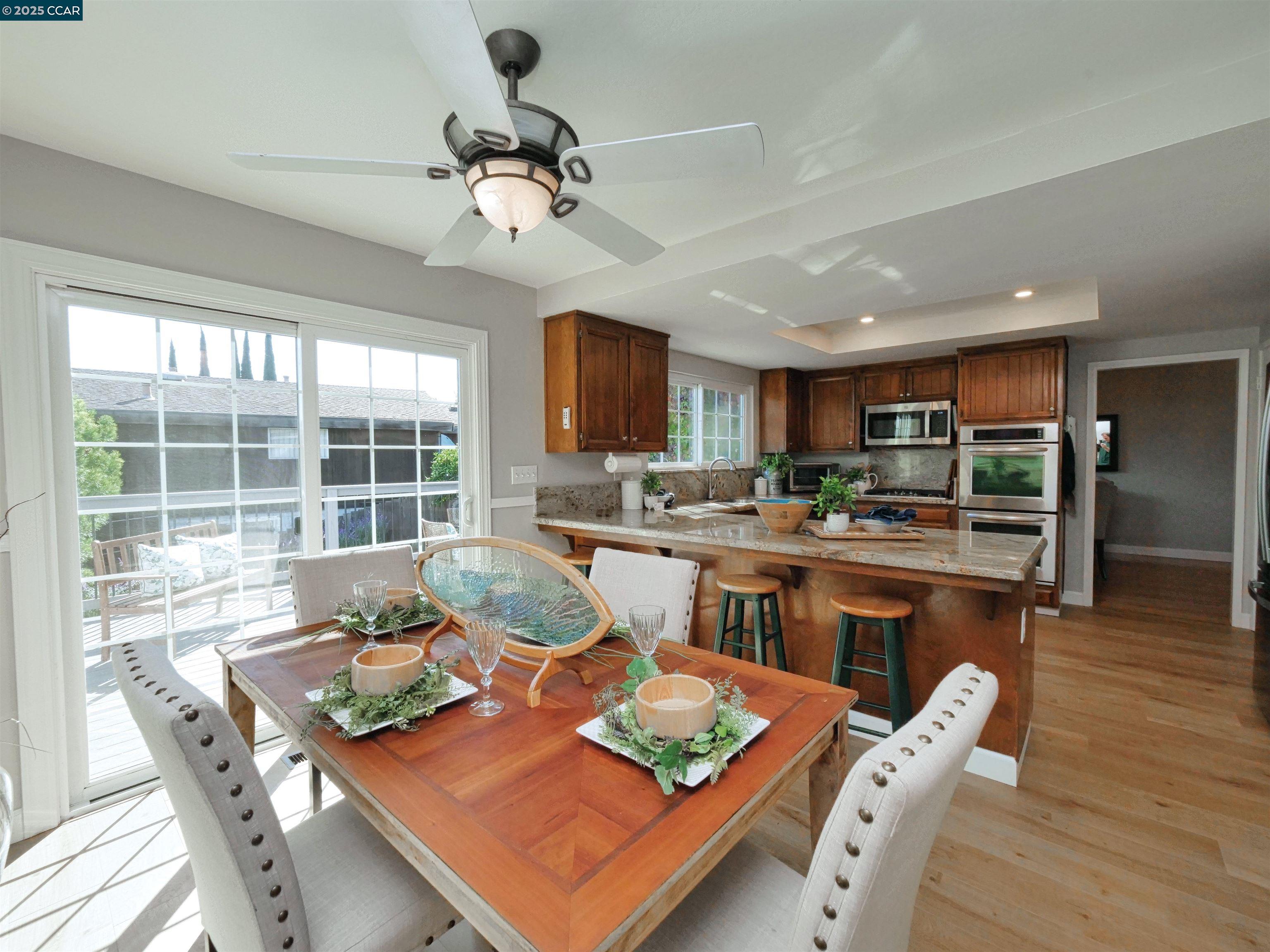 4044 Cowell Road Concord, CA 94518 - Photo 23 of 60 a living room with stainless steel appliances kitchen island granite countertop furniture and a kitchen view