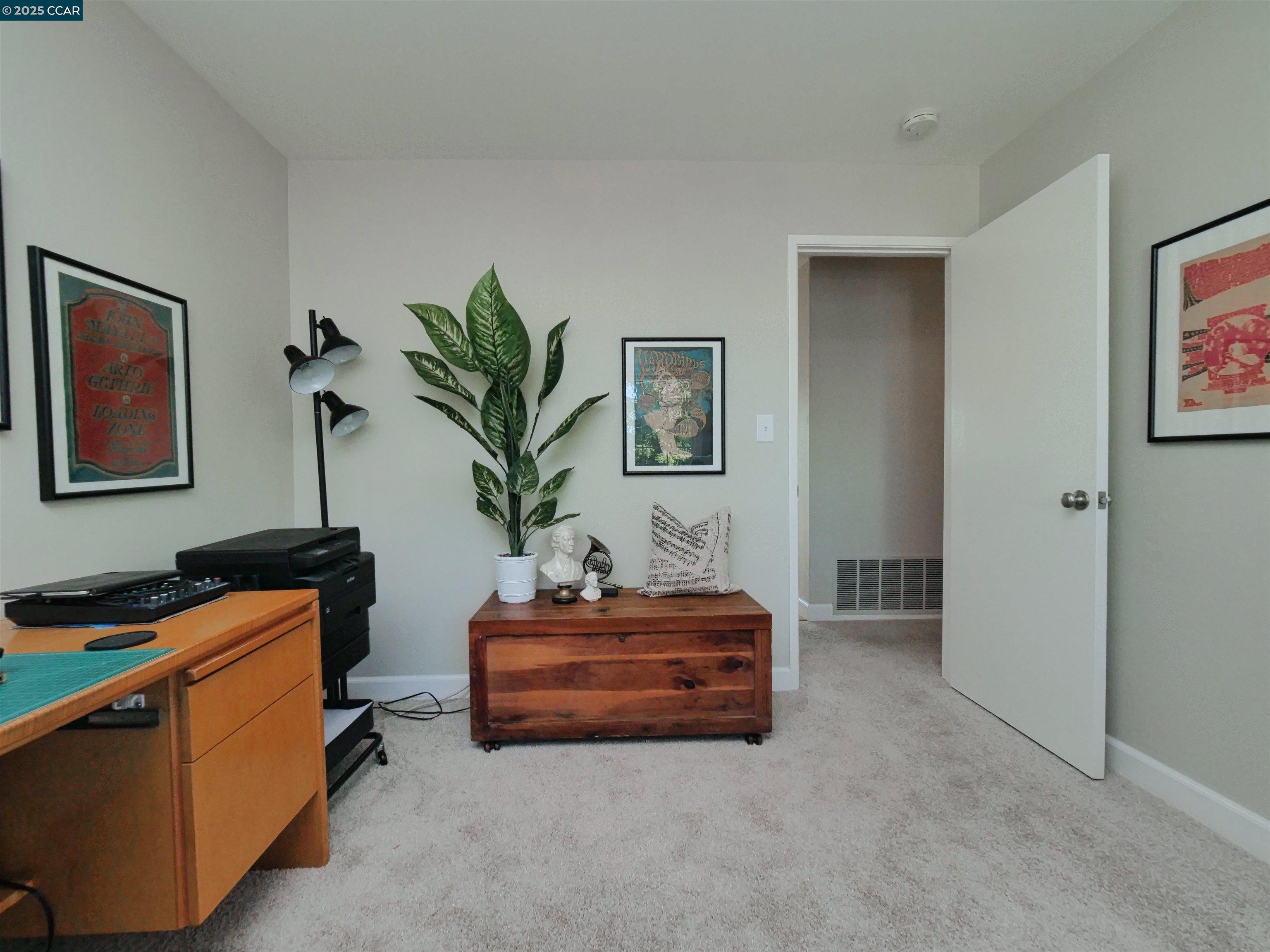4044 Cowell Road Concord, CA 94518 - Photo 32 of 60 a living room with furniture and a potted plant