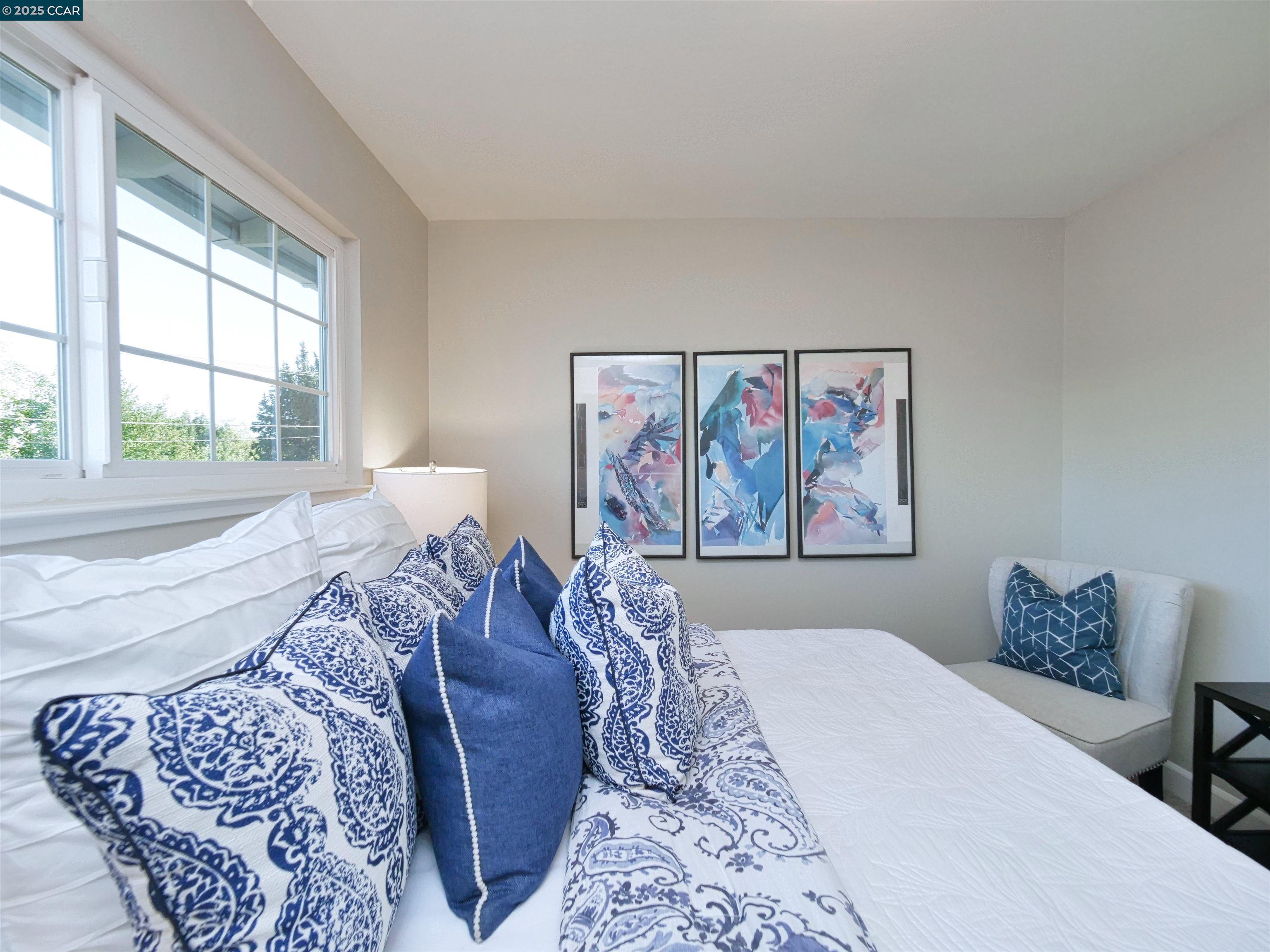 4044 Cowell Road Concord, CA 94518 - Photo 38 of 60 a bed sitting in a bedroom next to a window