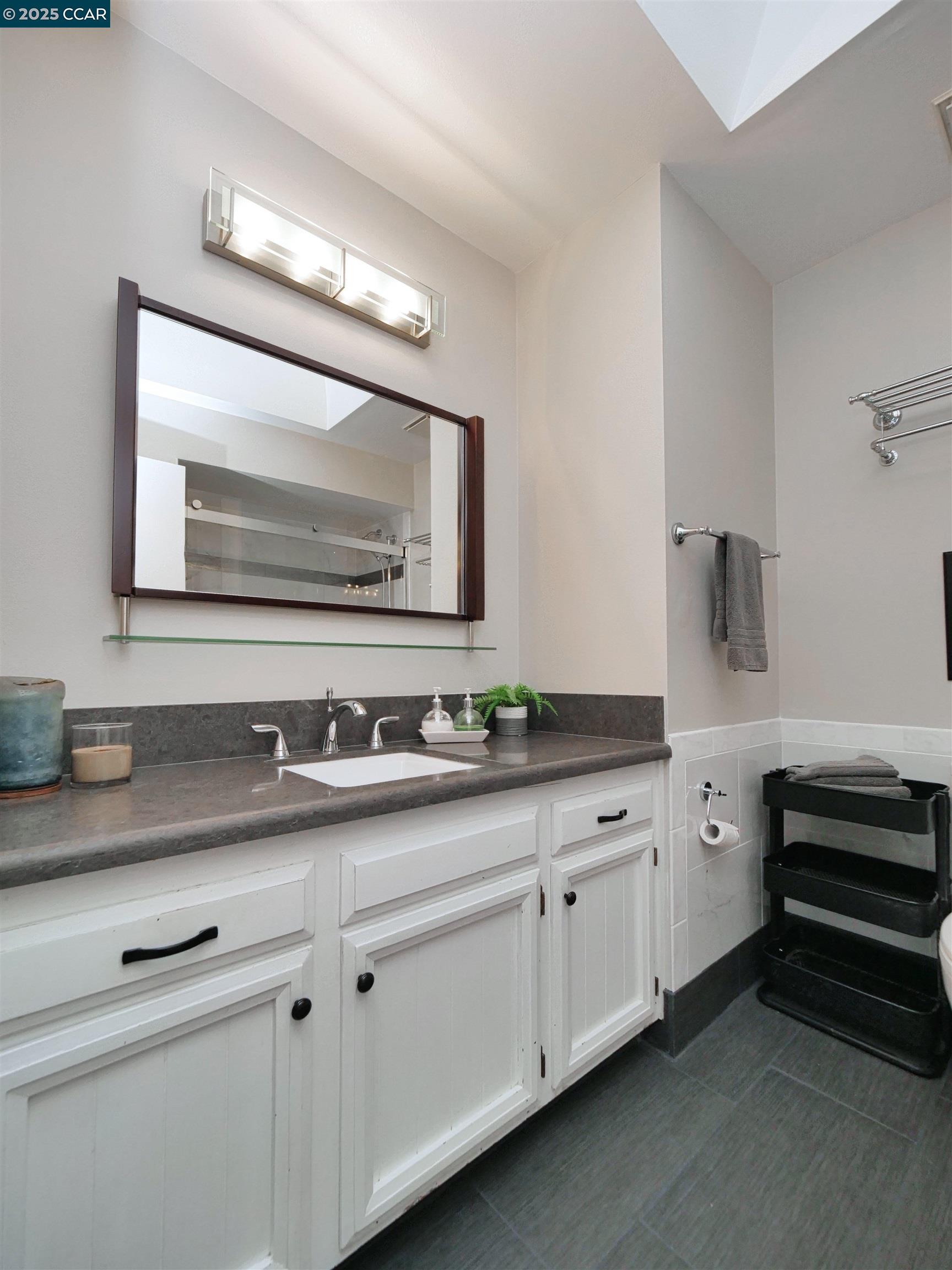 4044 Cowell Road Concord, CA 94518 - Photo 43 of 60 a bathroom with a sink and a mirror