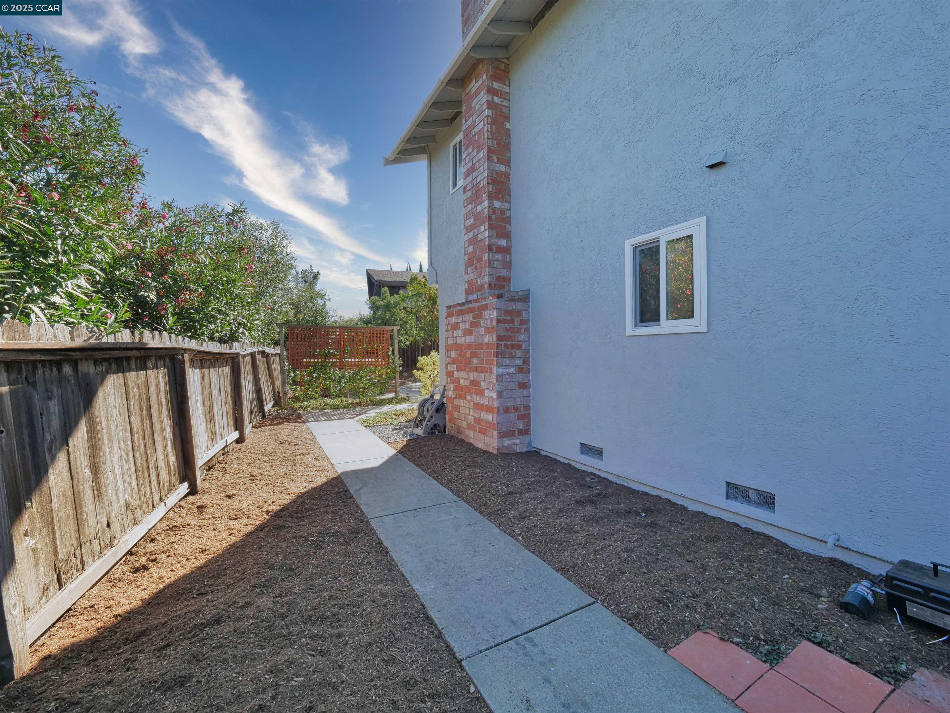 4044 Cowell Road Concord, CA 94518 - Photo 53 of 60 a view of a house with backyard and wooden fence