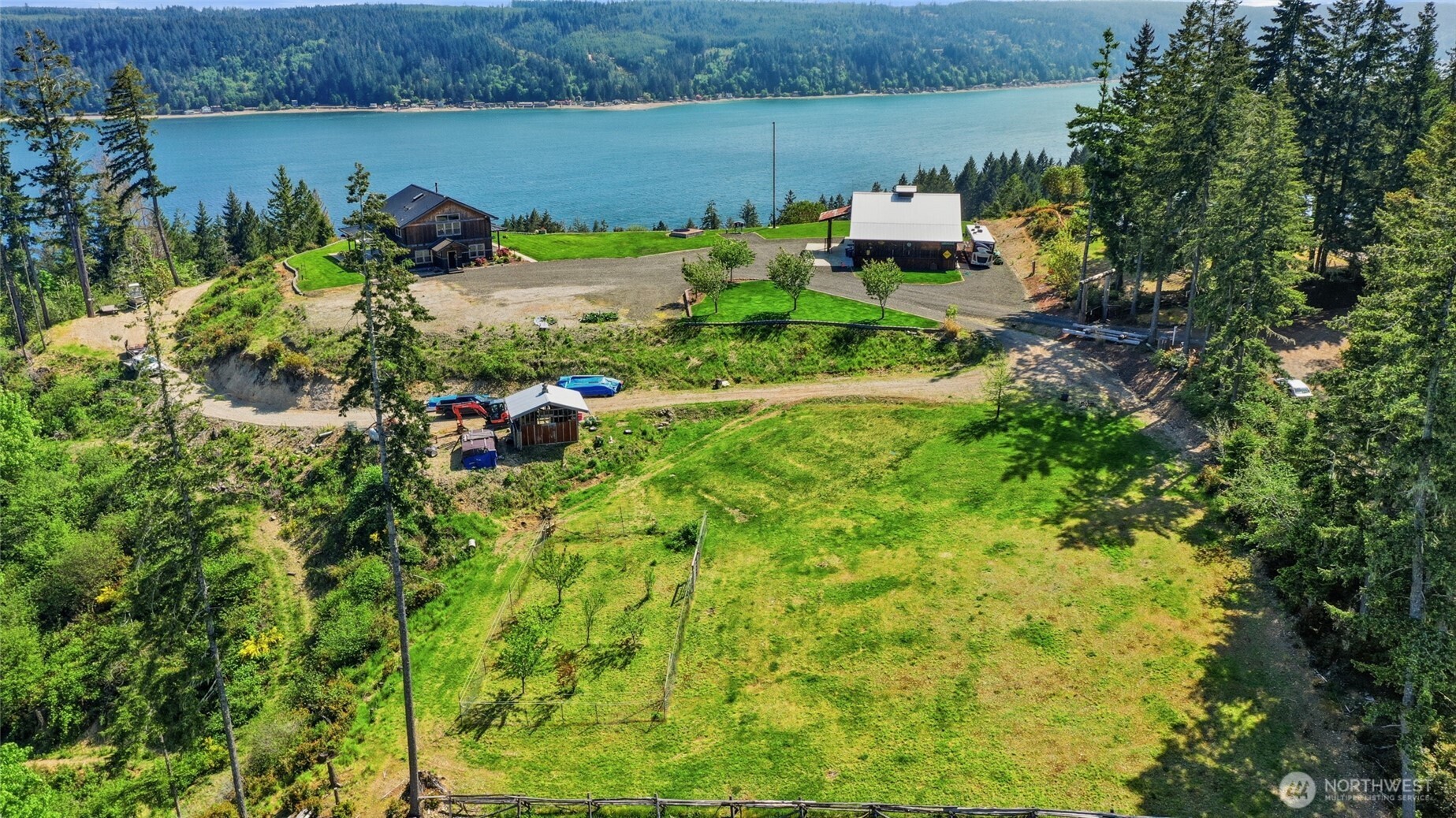 161 Northeast Belfair View Road Belfair, WA 98528 - Photo 2 of 40 an aerial view of a house with a yard and lake view