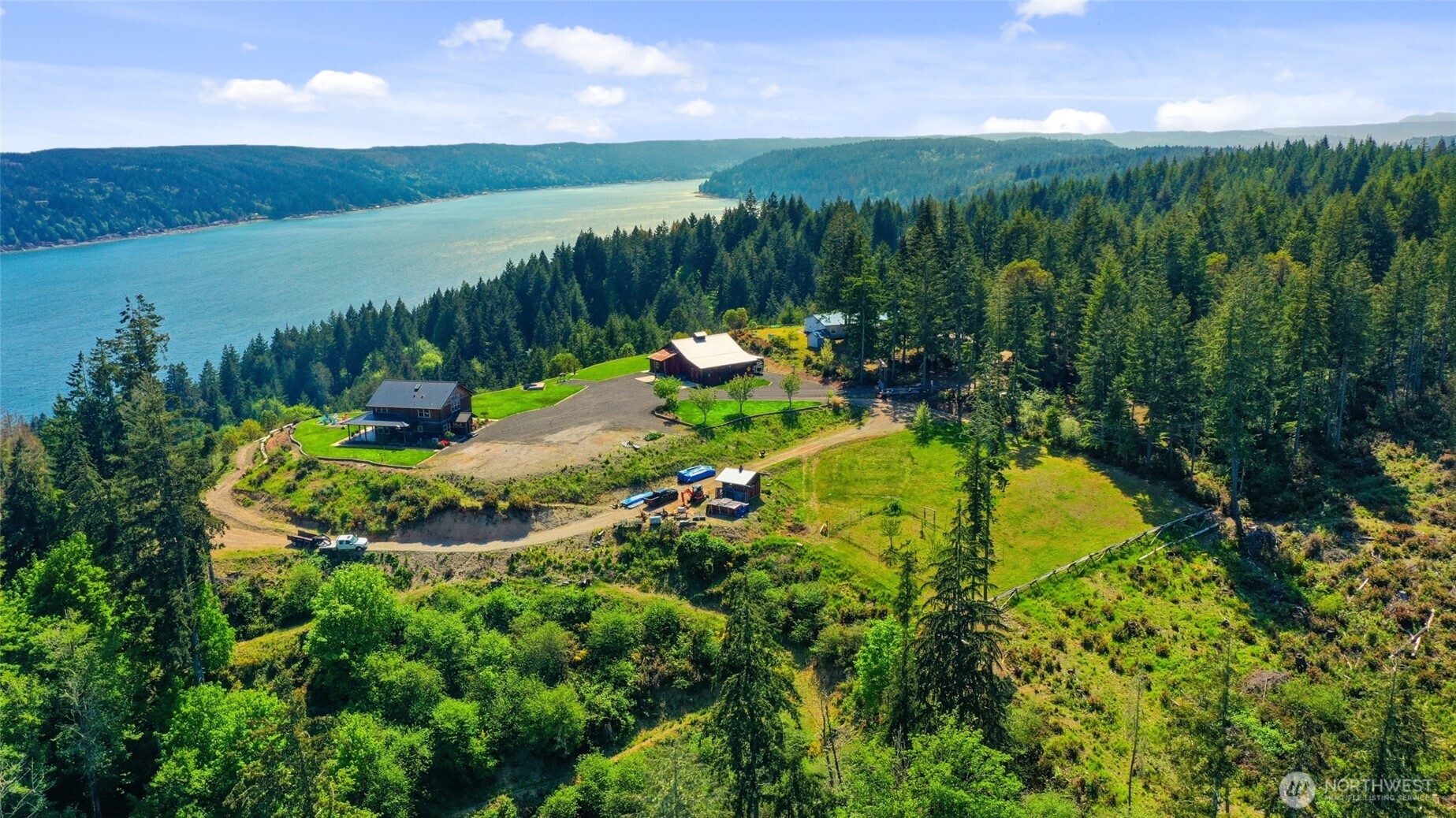 161 Northeast Belfair View Road Belfair, WA 98528 - Photo 29 of 40 a view of a lake with a yard