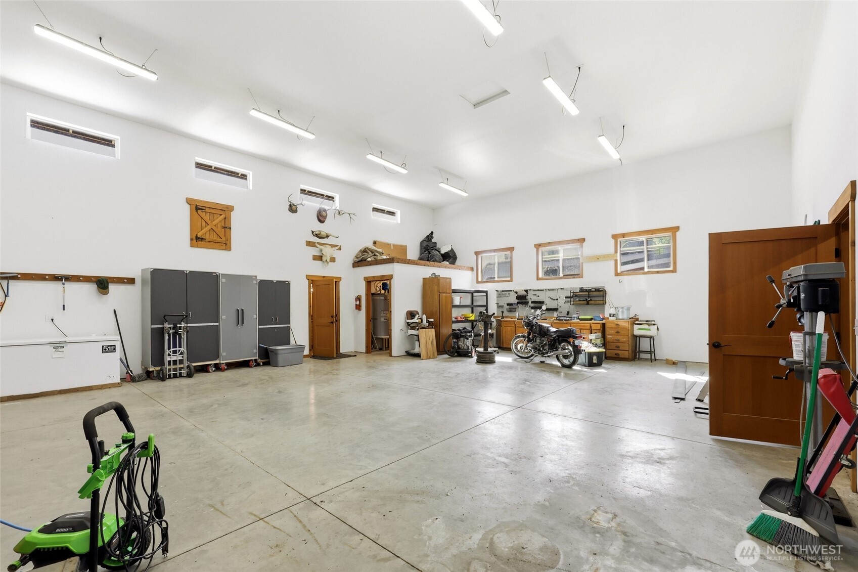 161 Northeast Belfair View Road Belfair, WA 98528 - Photo 31 of 40 a view of a room with gym equipment and a large window