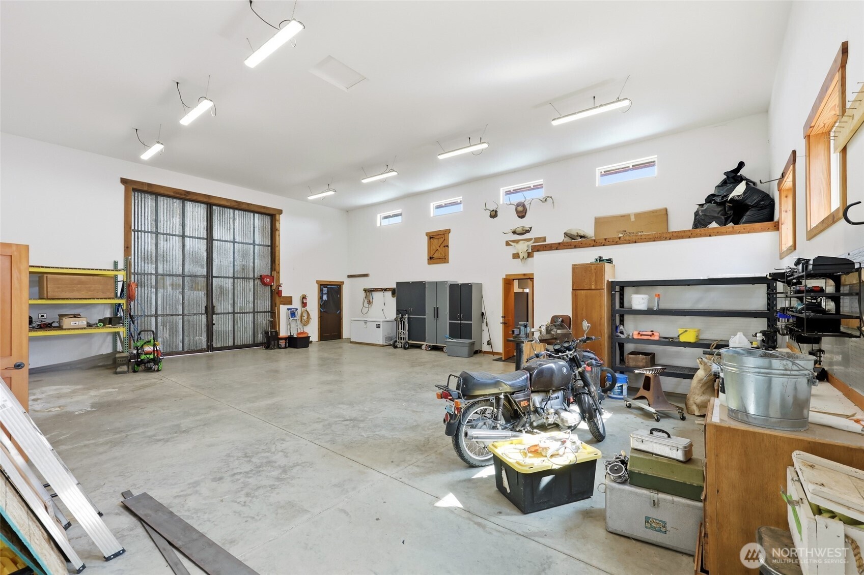 161 Northeast Belfair View Road Belfair, WA 98528 - Photo 32 of 40 a room with gym equipment and a large window