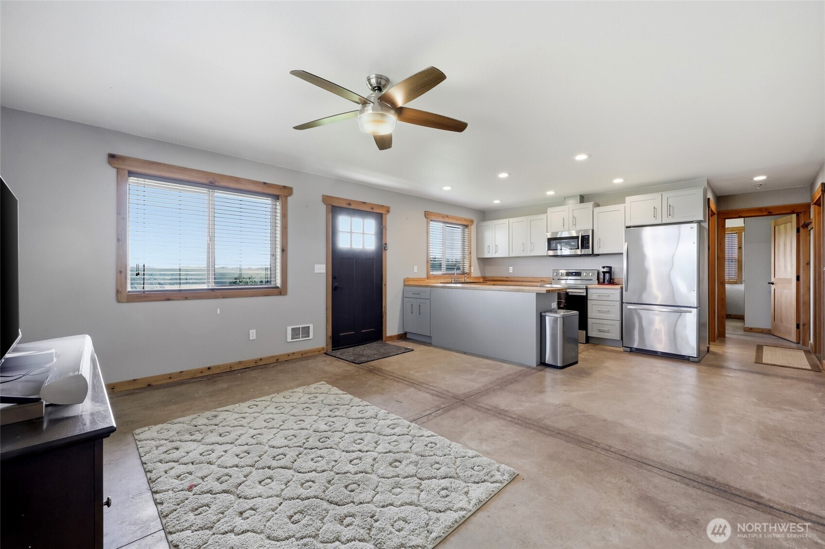 161 Northeast Belfair View Road Belfair, WA 98528 - Photo 34 of 40 a view of a kitchen with furniture wooden floor and windows