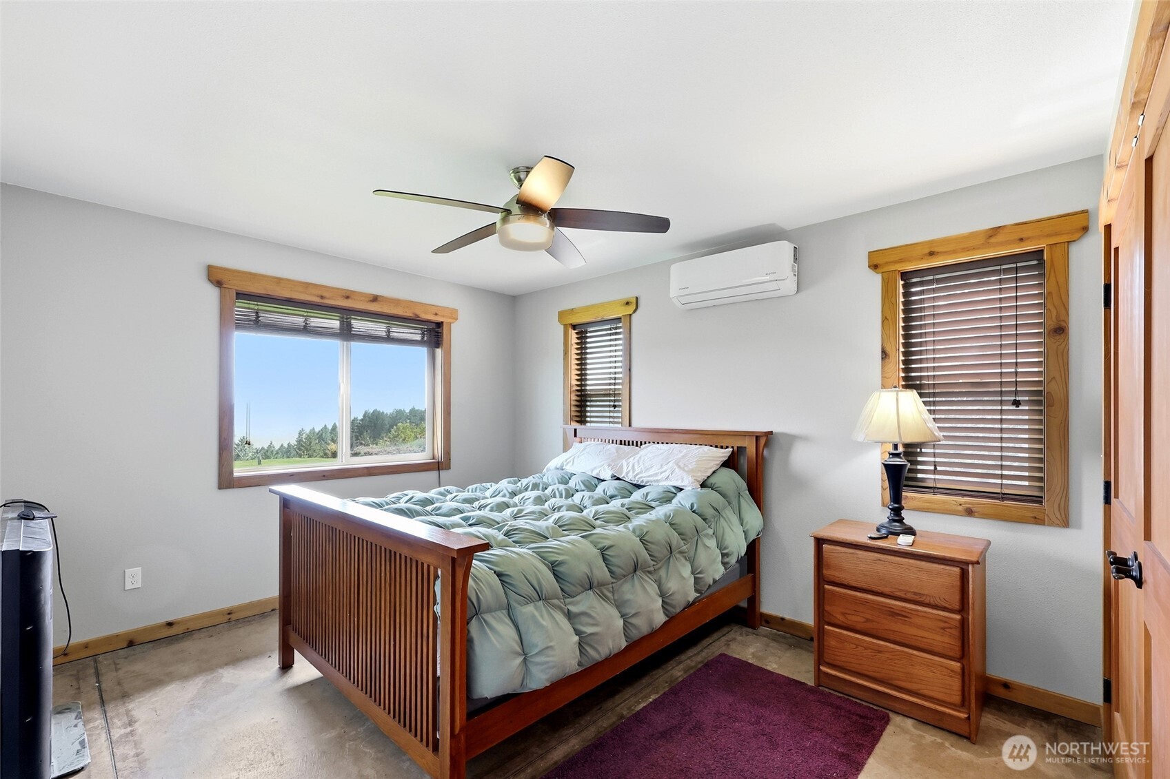 161 Northeast Belfair View Road Belfair, WA 98528 - Photo 35 of 40 a bedroom with a bed and a chandelier