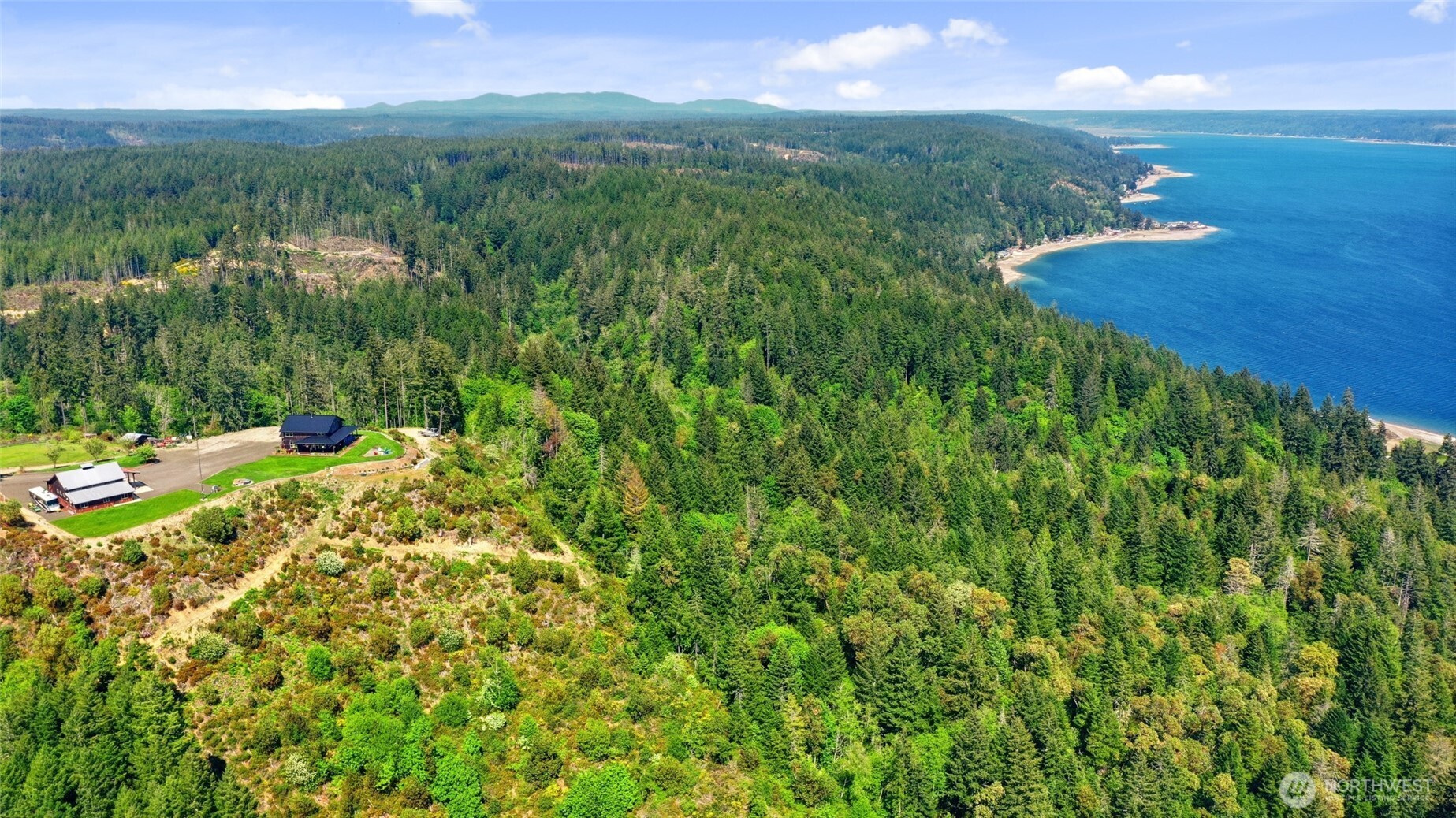 161 Northeast Belfair View Road Belfair, WA 98528 - Photo 39 of 40 a view of a lake with a yard