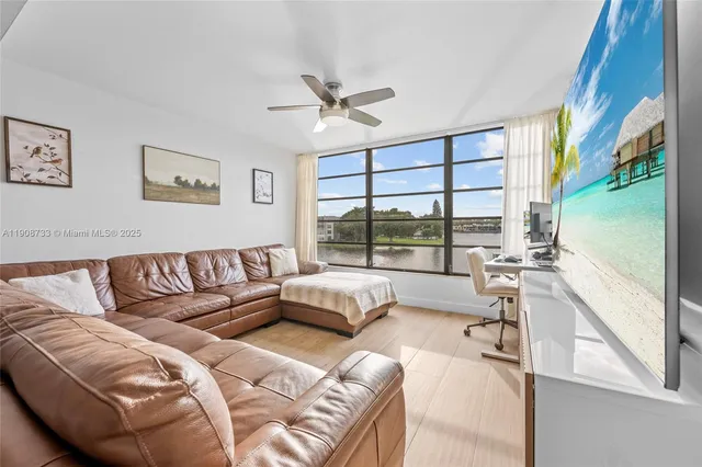 a large bedroom with a large bed and a large window