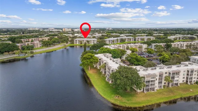 a view of a swimming pool with a yard